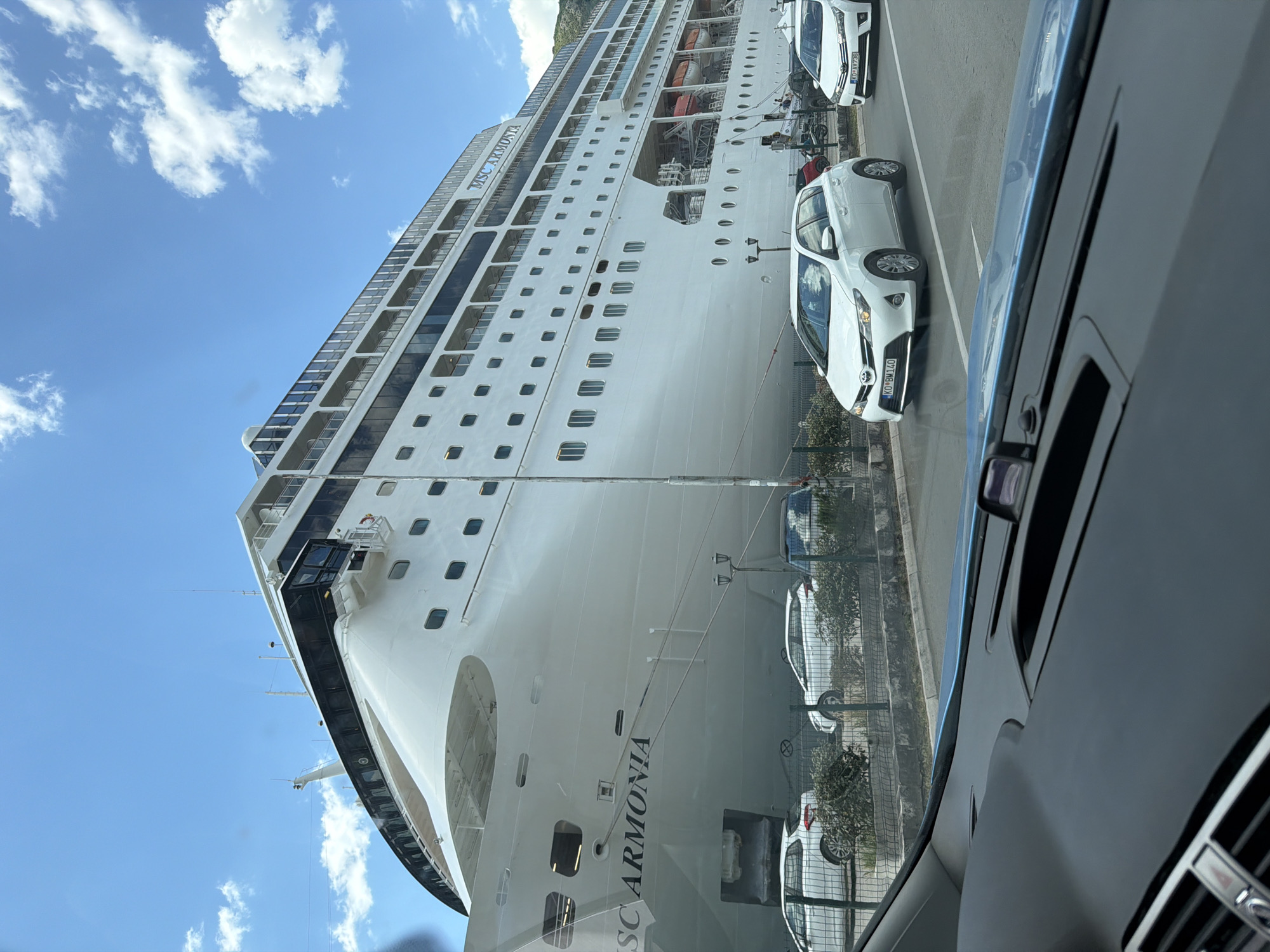 MSC Armonia cruise ship docks in Kotor, tourists gather