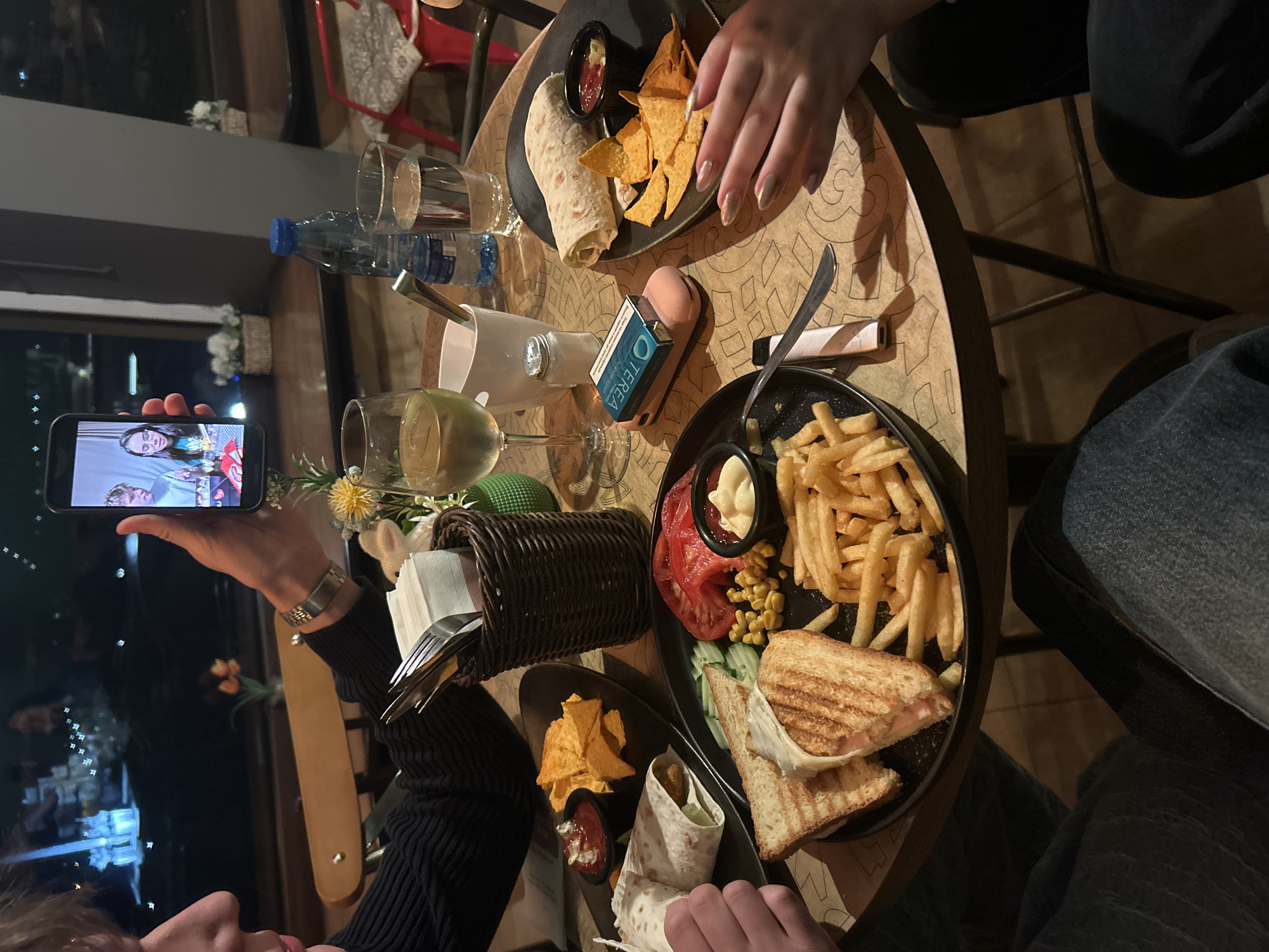 Diners video call during meal at Veliko Tarnovo restaurant