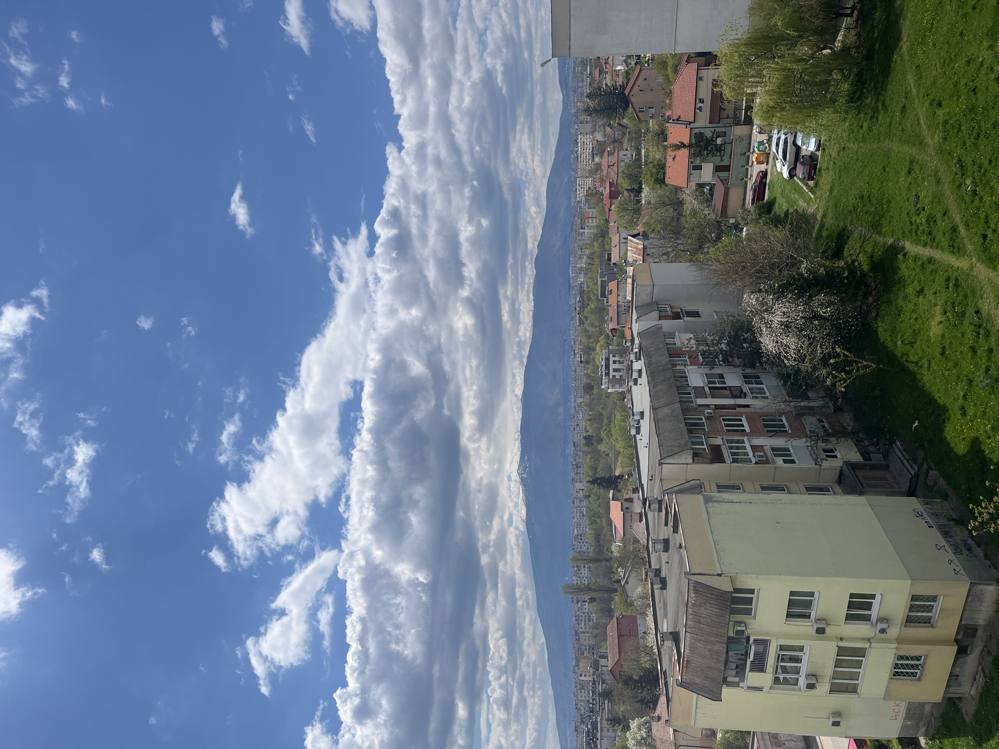 Sofia cityscape documented under spring skies with mountain backdrop