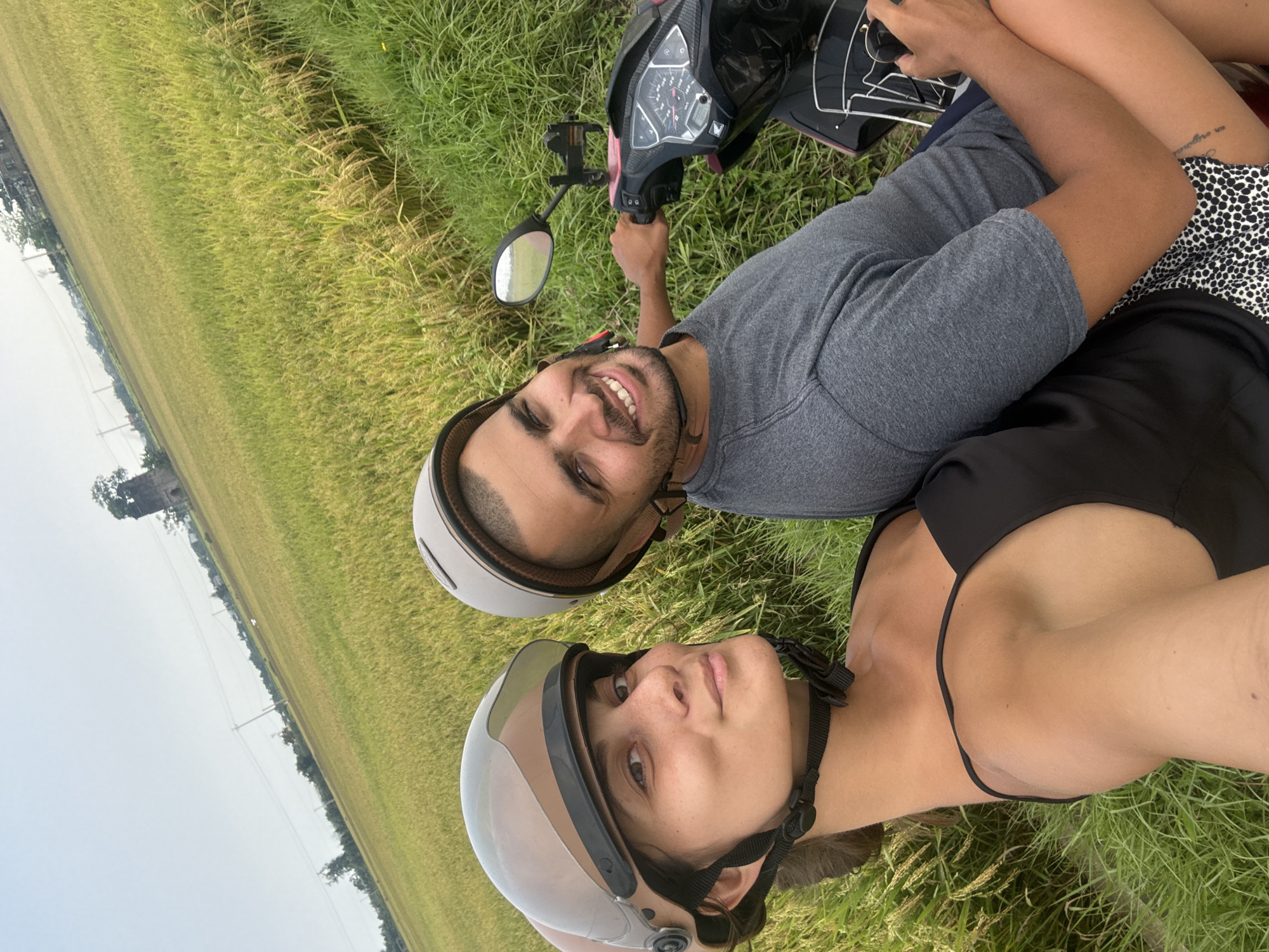 Couple documents scooter ride through Vietnam rice paddies