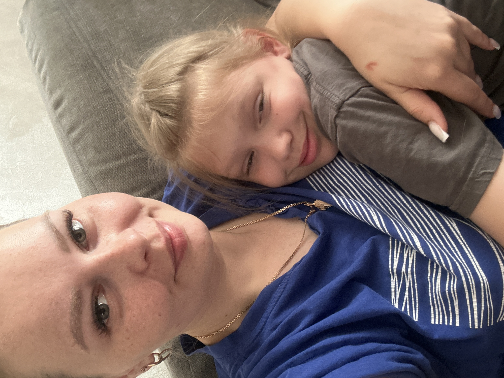 Lazy afternoon at home with a cat and a sleeping child