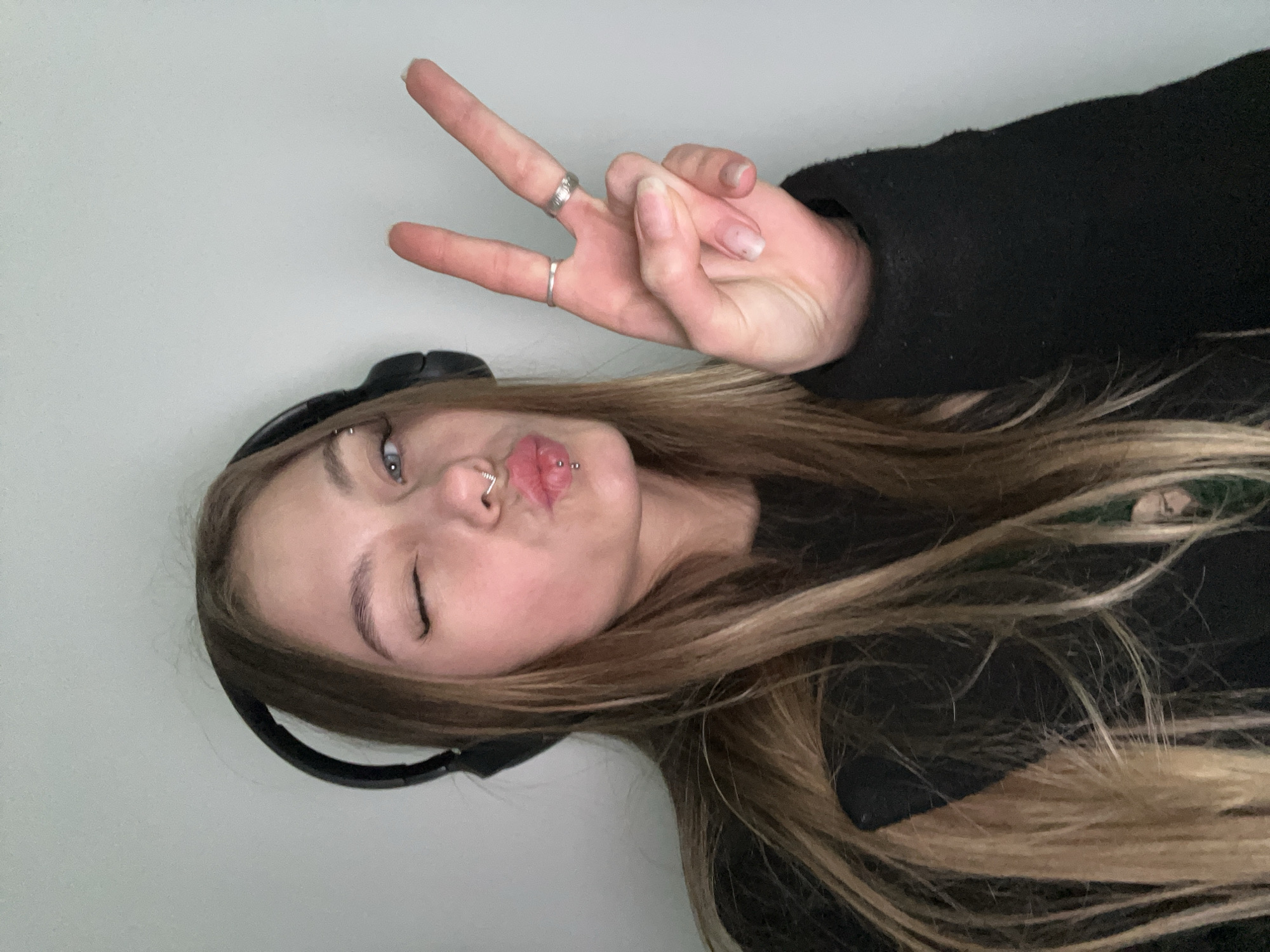 Woman makes peace sign gesture in Russian town