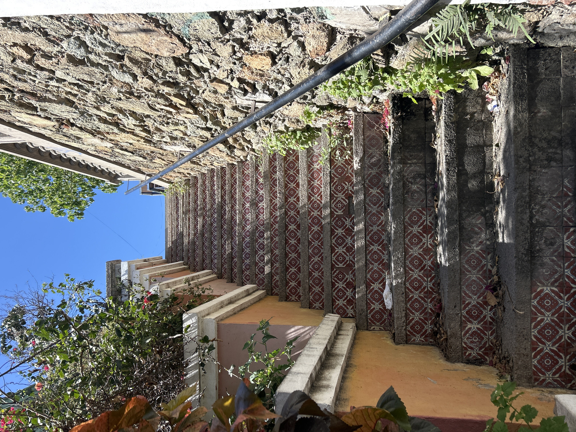 Geometric tiled stairs with metal railing observed in Mazatlán