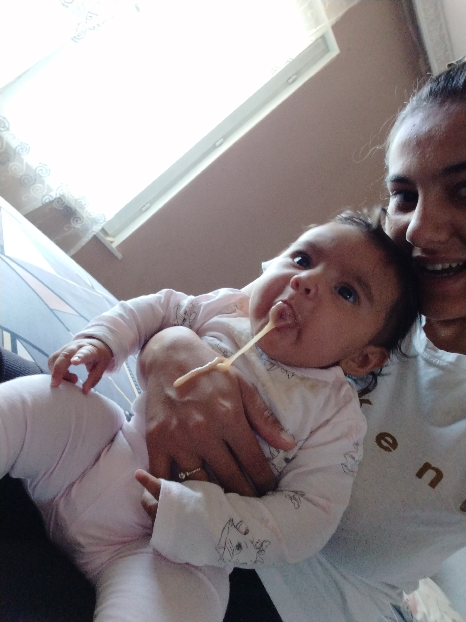 Woman and baby share quiet morning moments at home