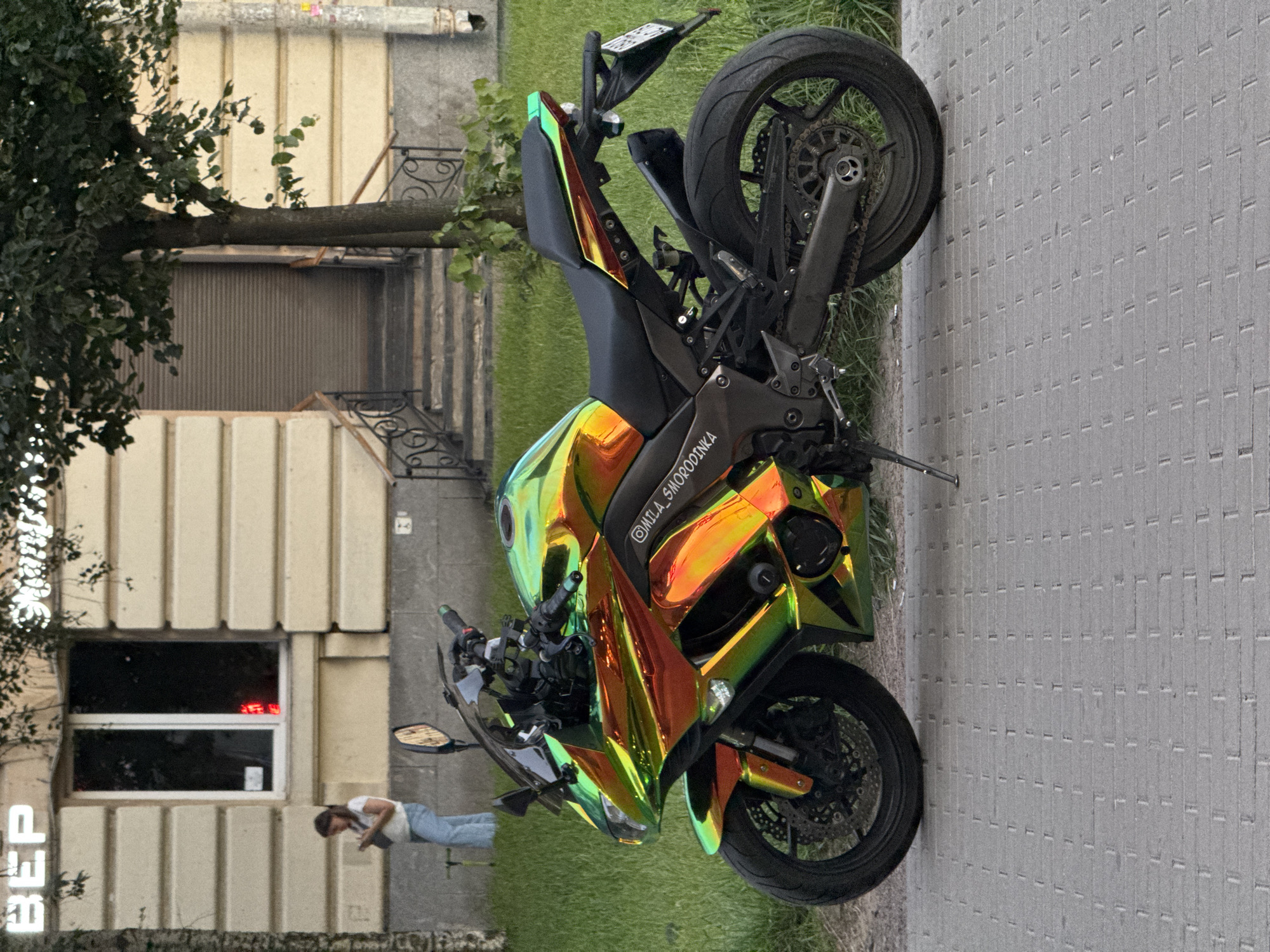 Iridescent sport motorcycle parked on a Russian city street