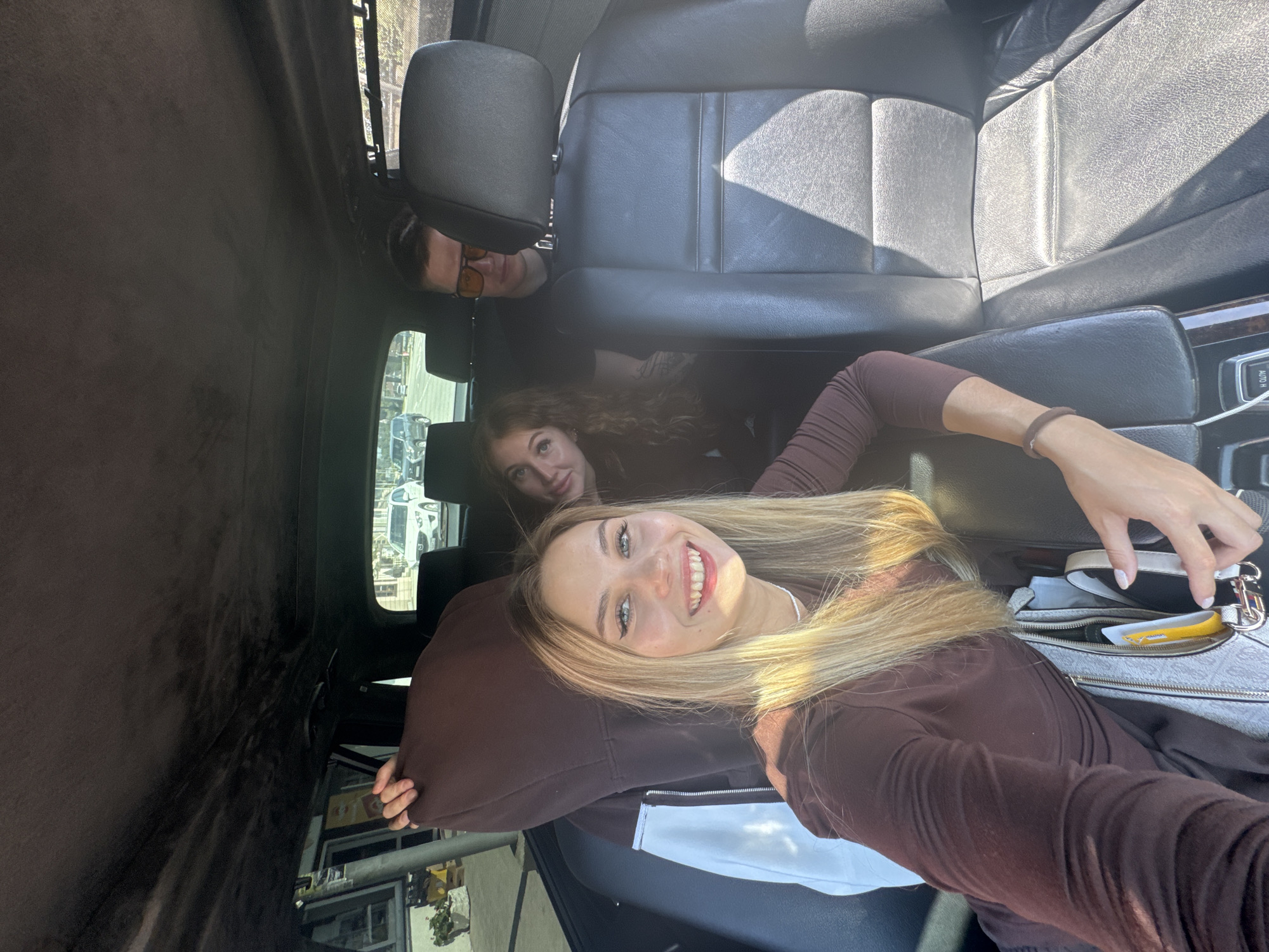 Three people photographed inside car in New Athos, Abkhazia