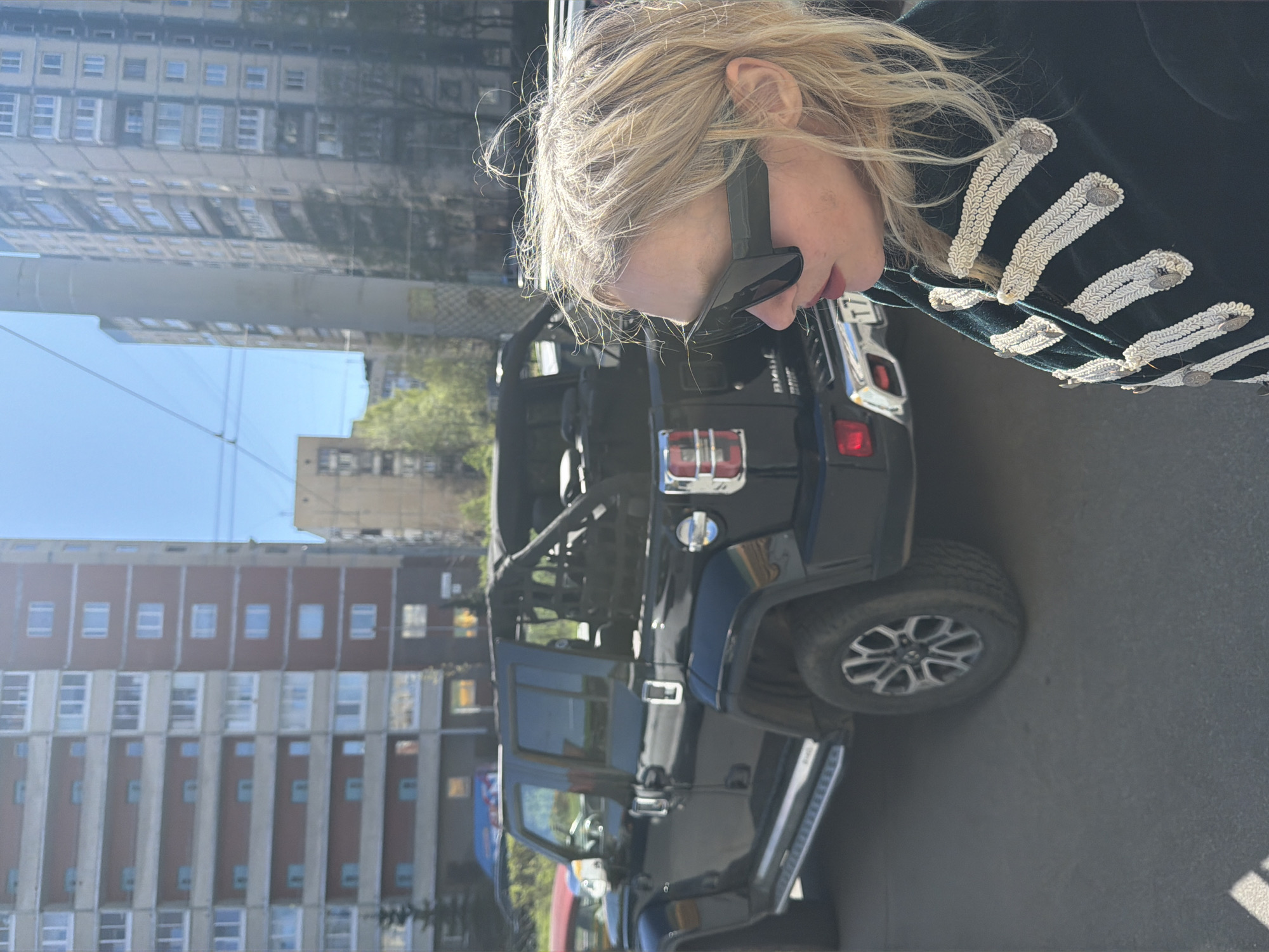 Woman poses with Jeep, meditation hashtag captured in Saint Petersburg