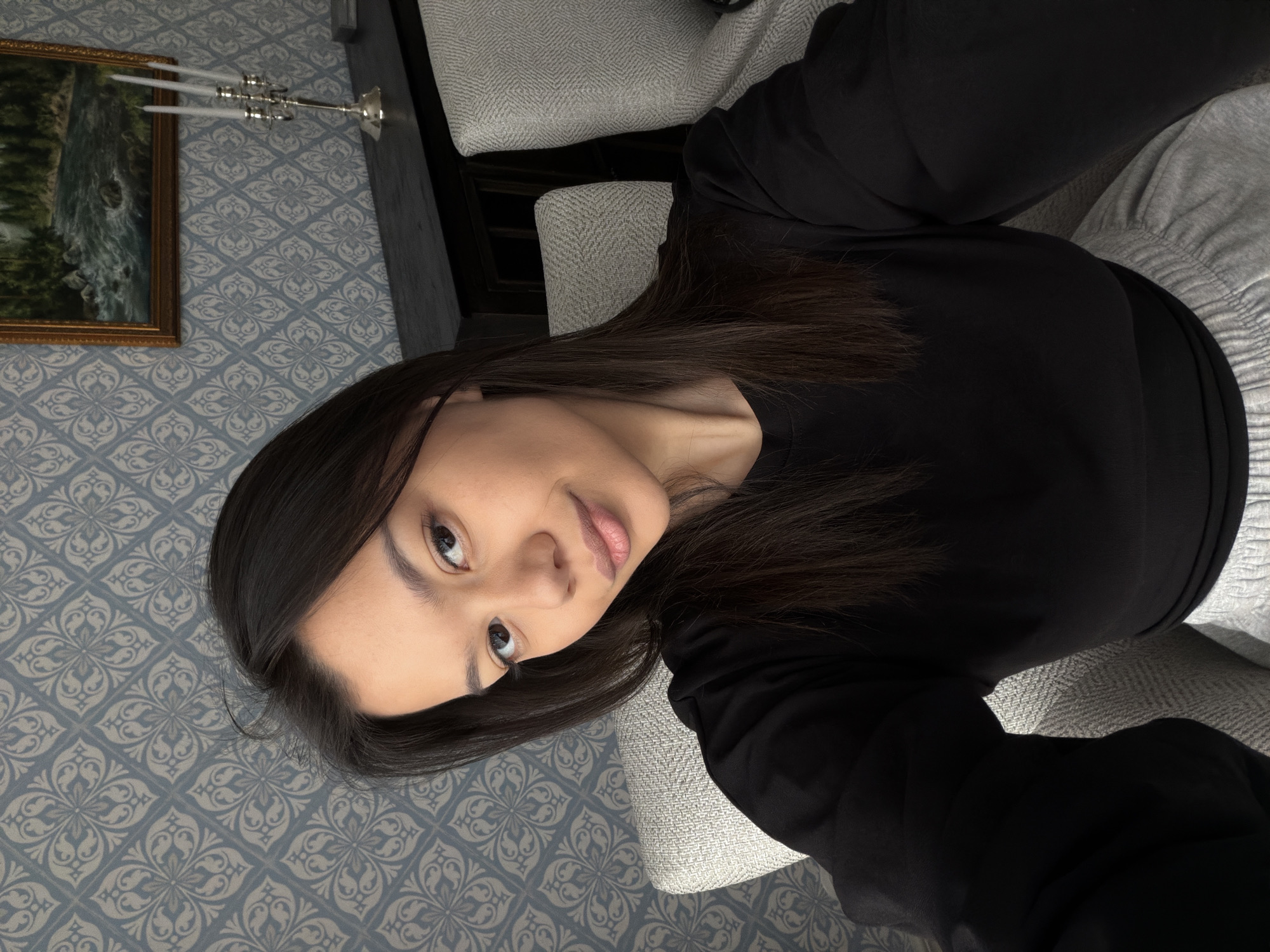 Woman relaxes at home with coffee in Krasnoyarsk