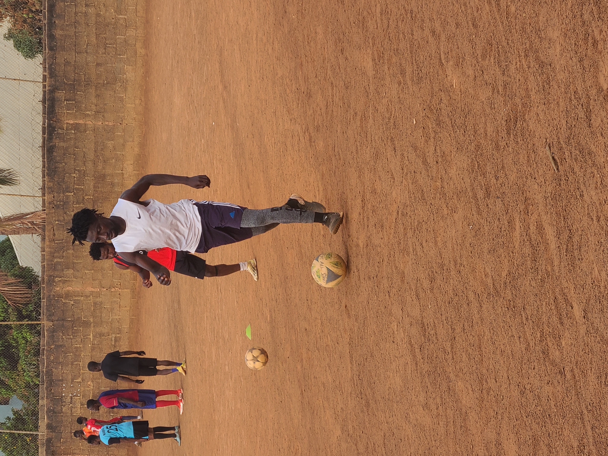 Soccer training session held on dirt field in Nigeria