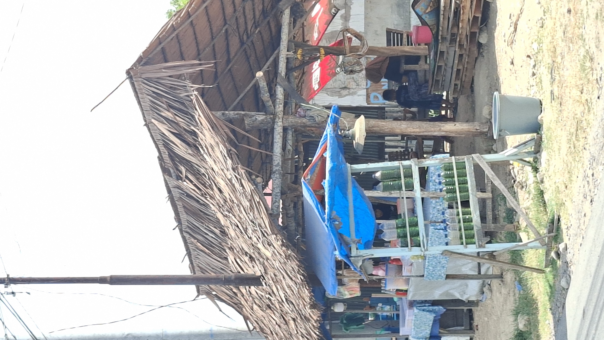 Roadside fuel stall and motorcycle ride through Lhokseumawe