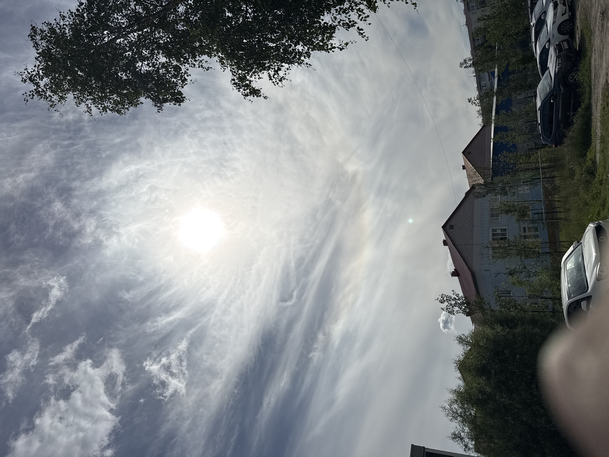 Midday drive through Usinsk under a hazy summer sky