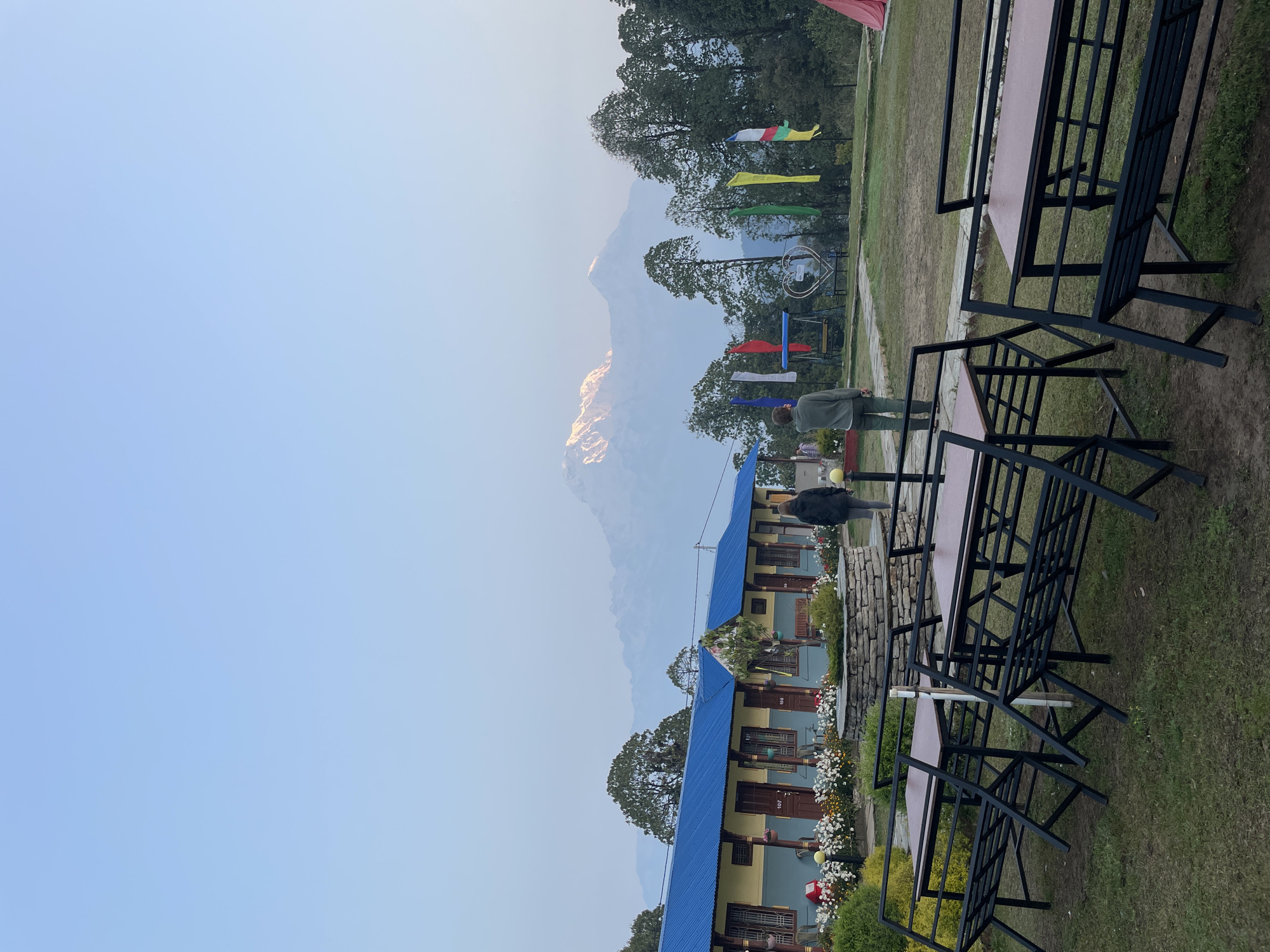 Blue-roofed building with outdoor furniture captured in Bhindabari, Nepal