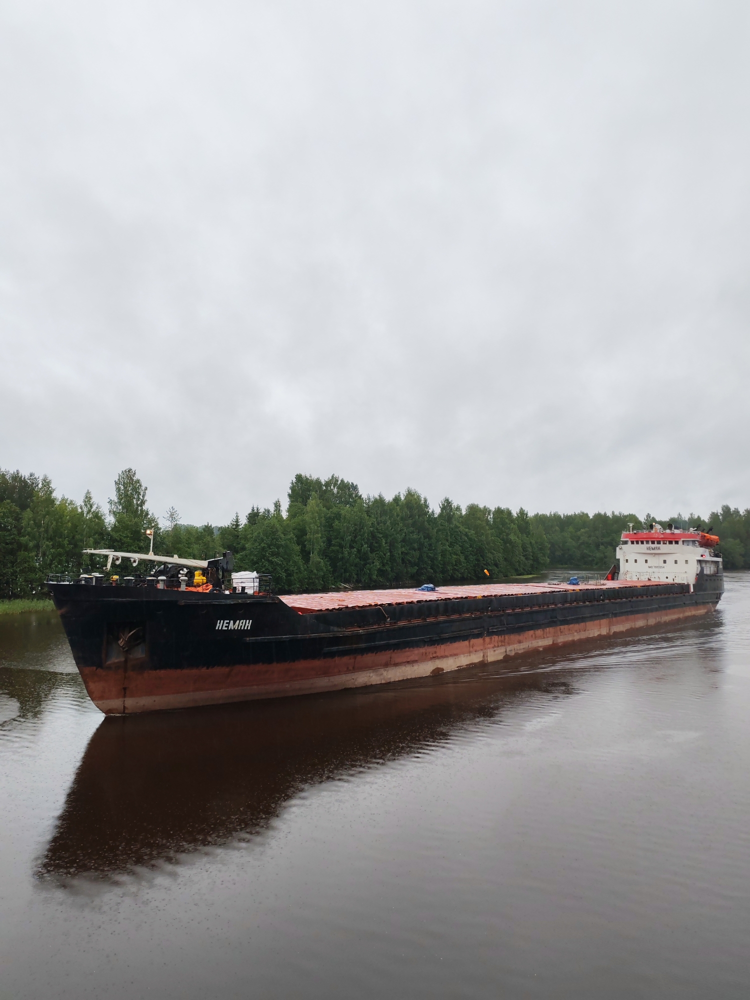 Cargo barge NEMAN transiting a calm Russian river
