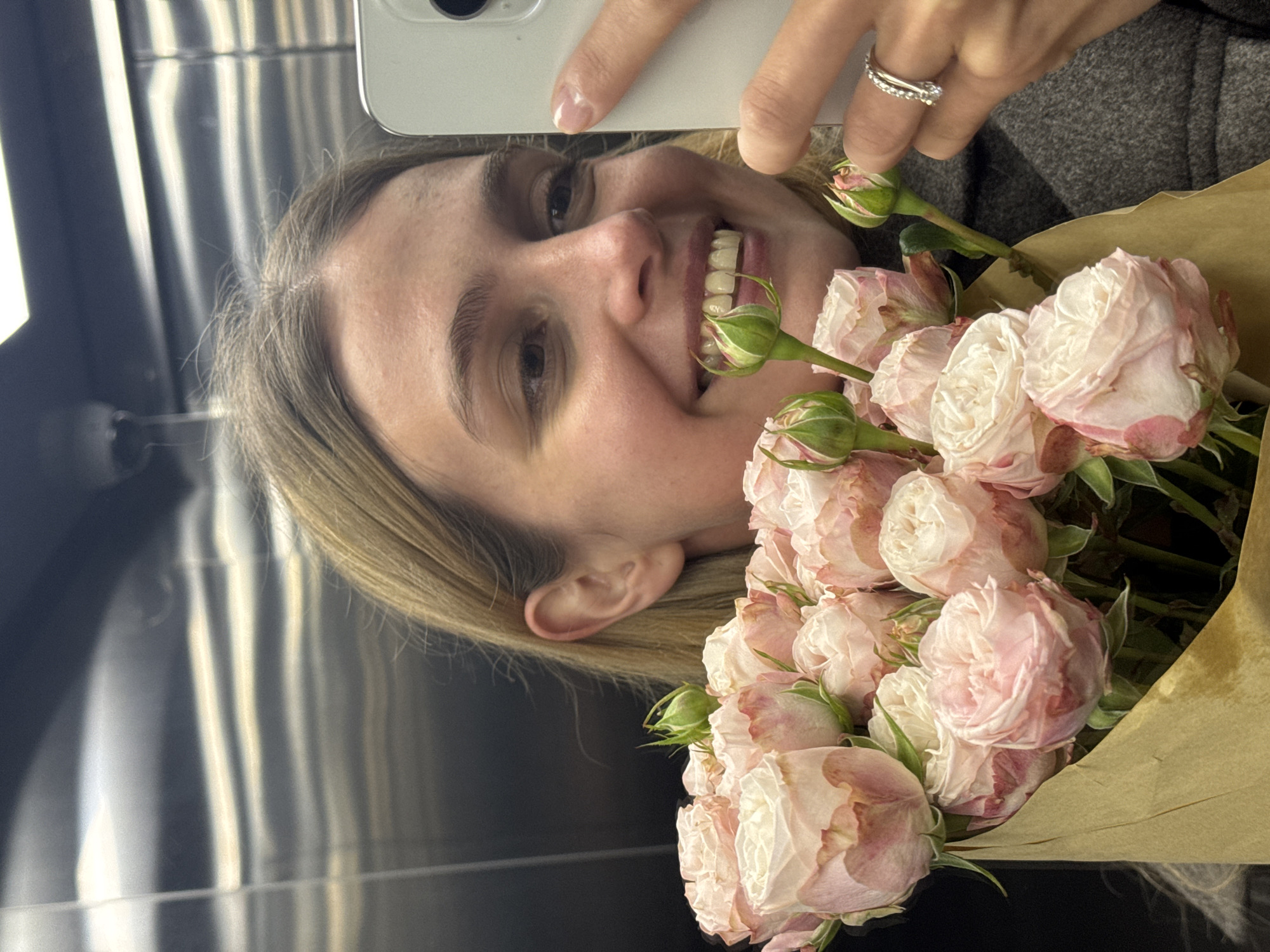Woman Takes Elevator Selfies With Rose Bouquet