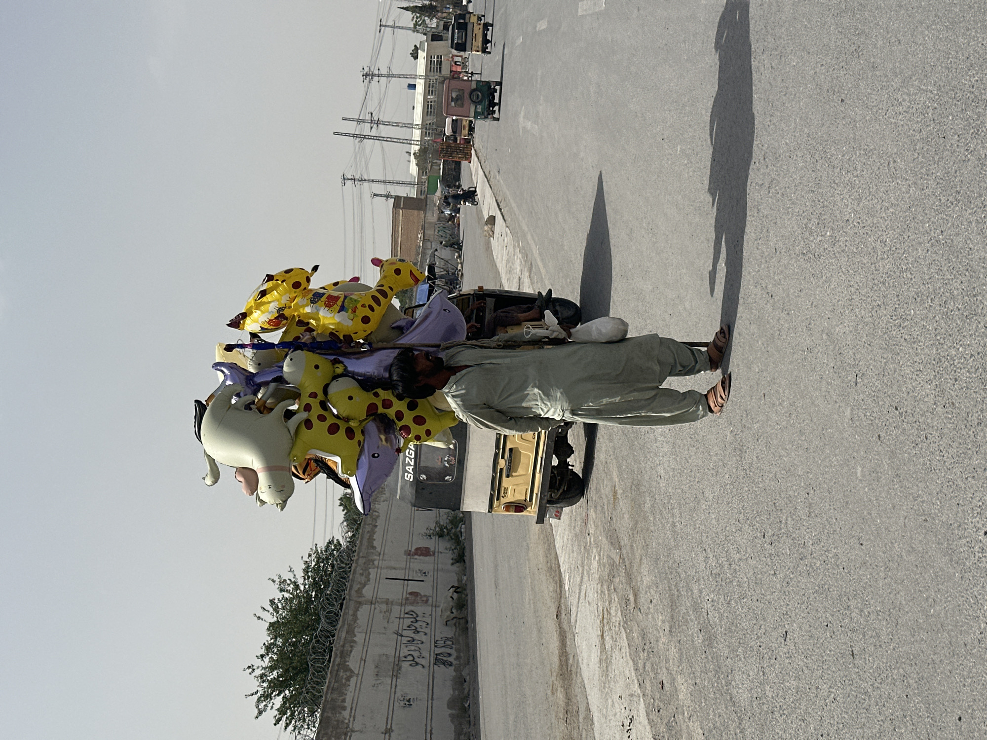 Balloon vendor pushes cart through Quetta streets