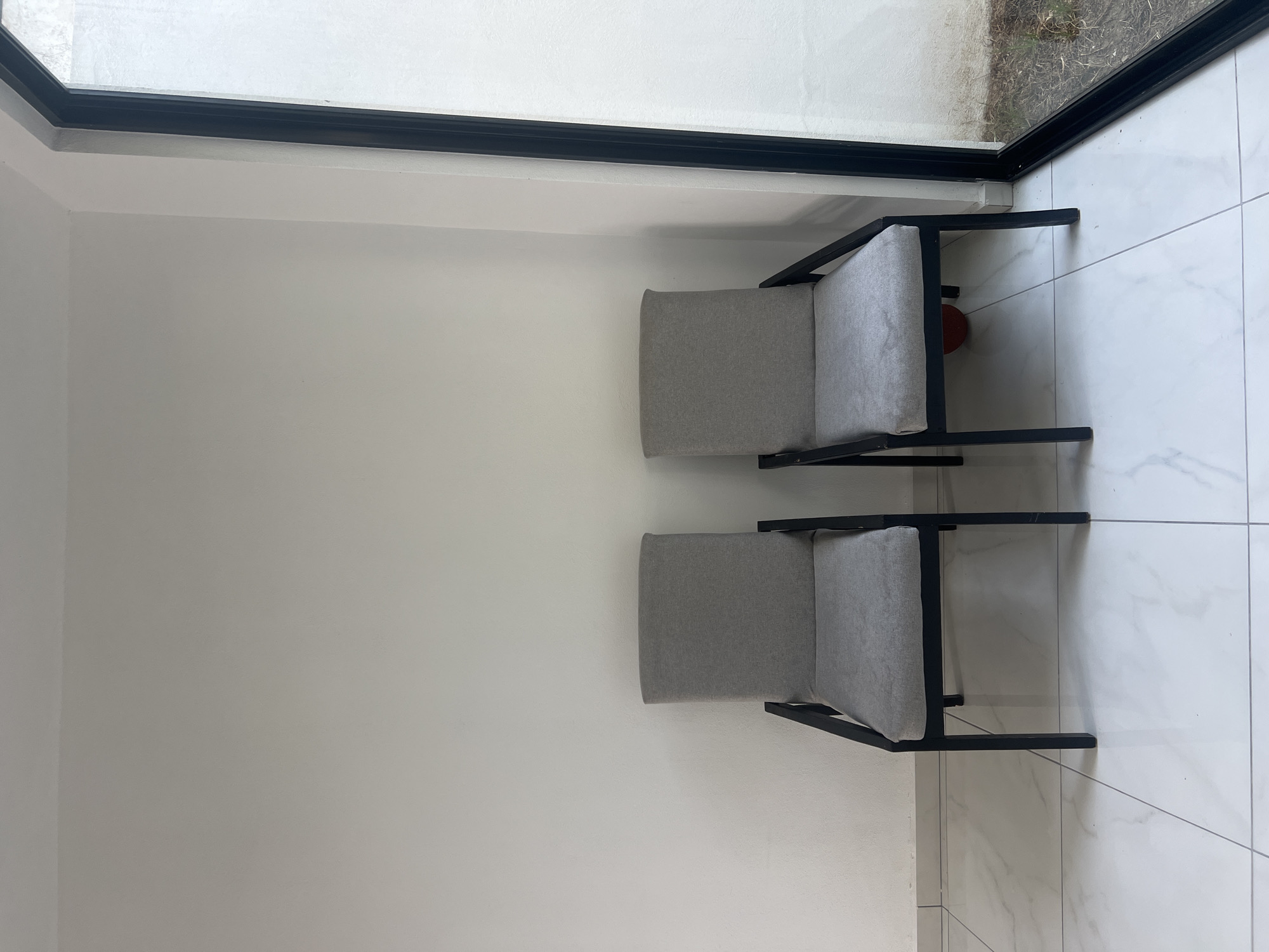 Contemporary chairs documented in modern Cholula interior space