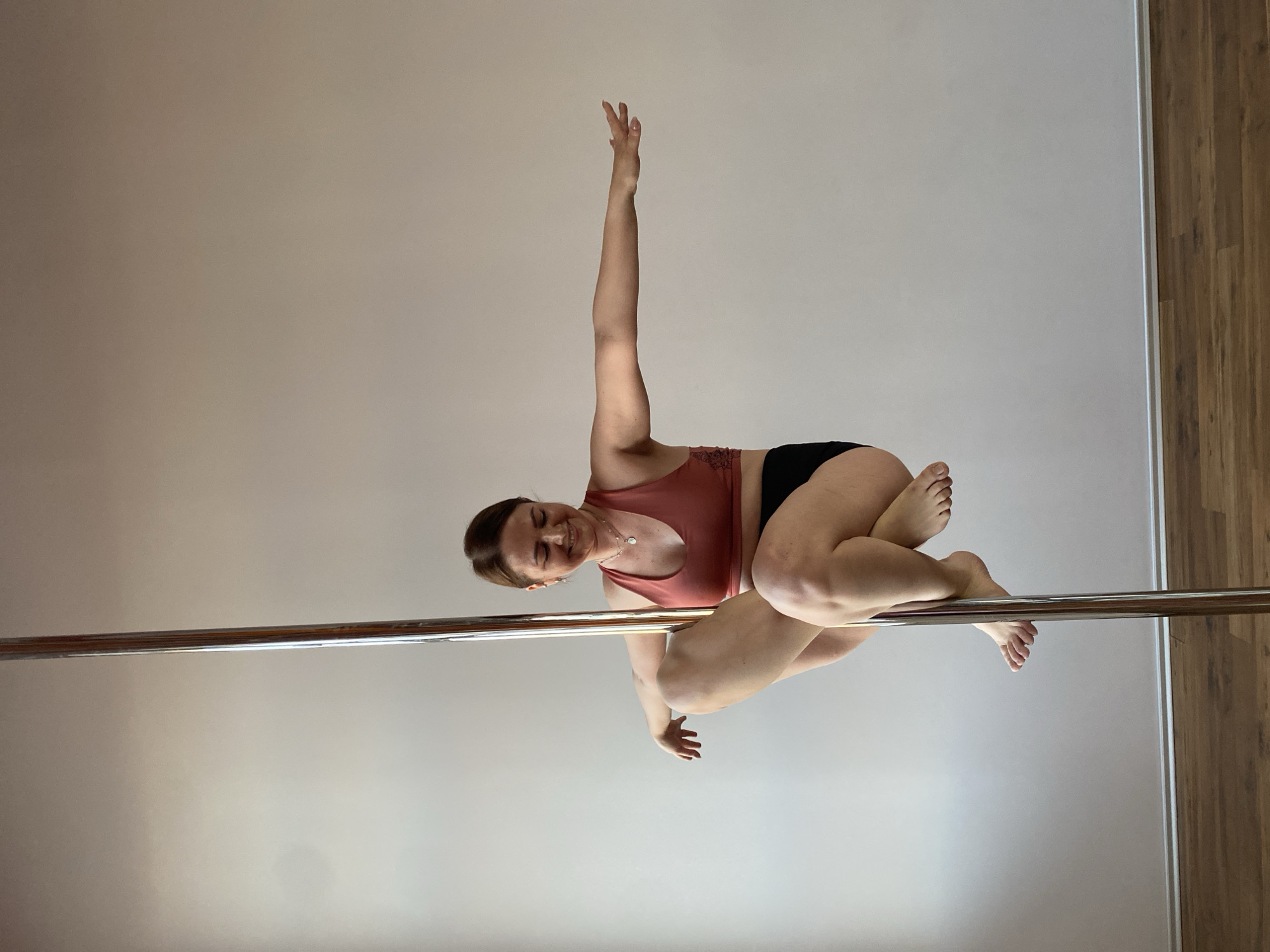 Woman practices pole dancing at Yekaterinburg fitness facility