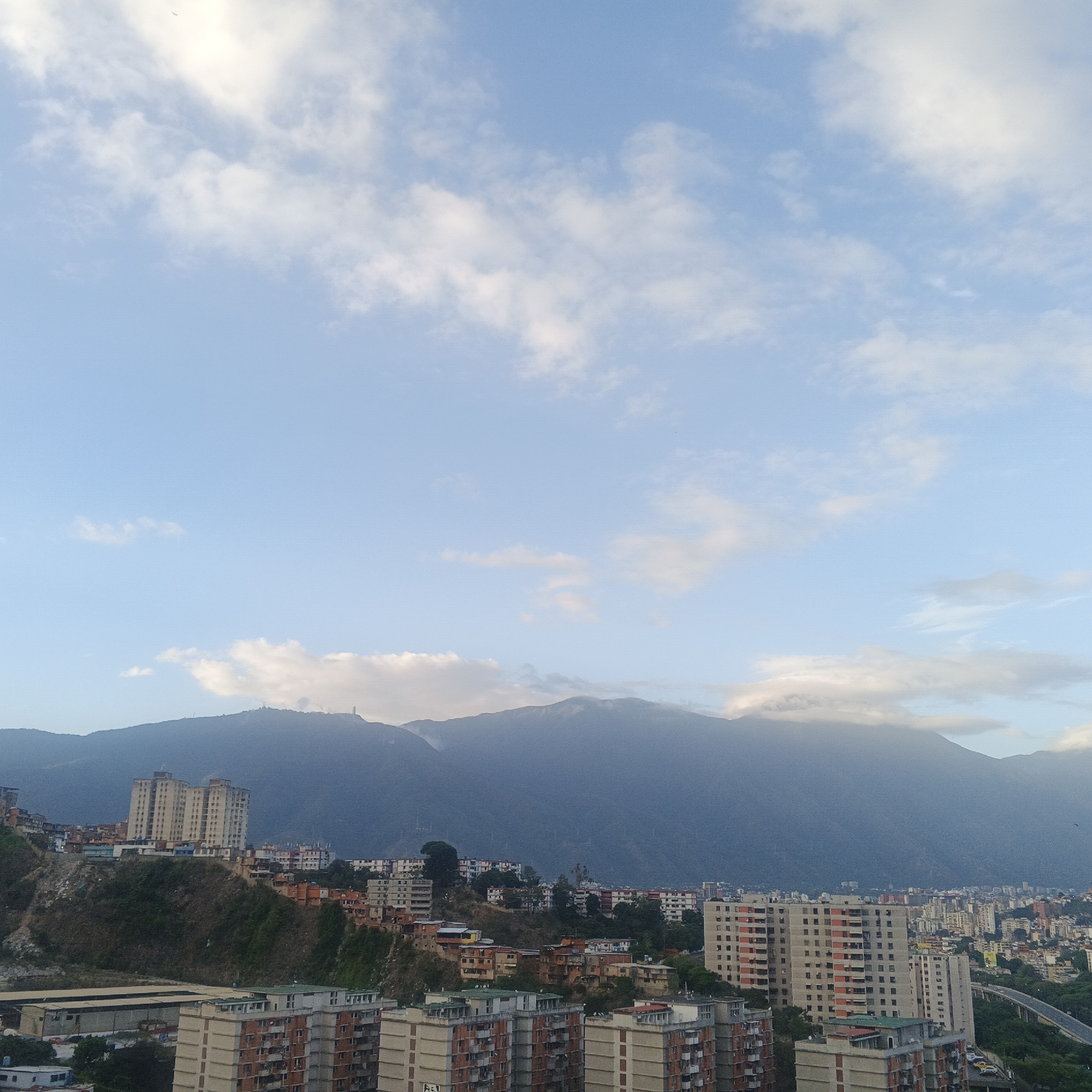 Caracas cityscape and child documented in evening hour