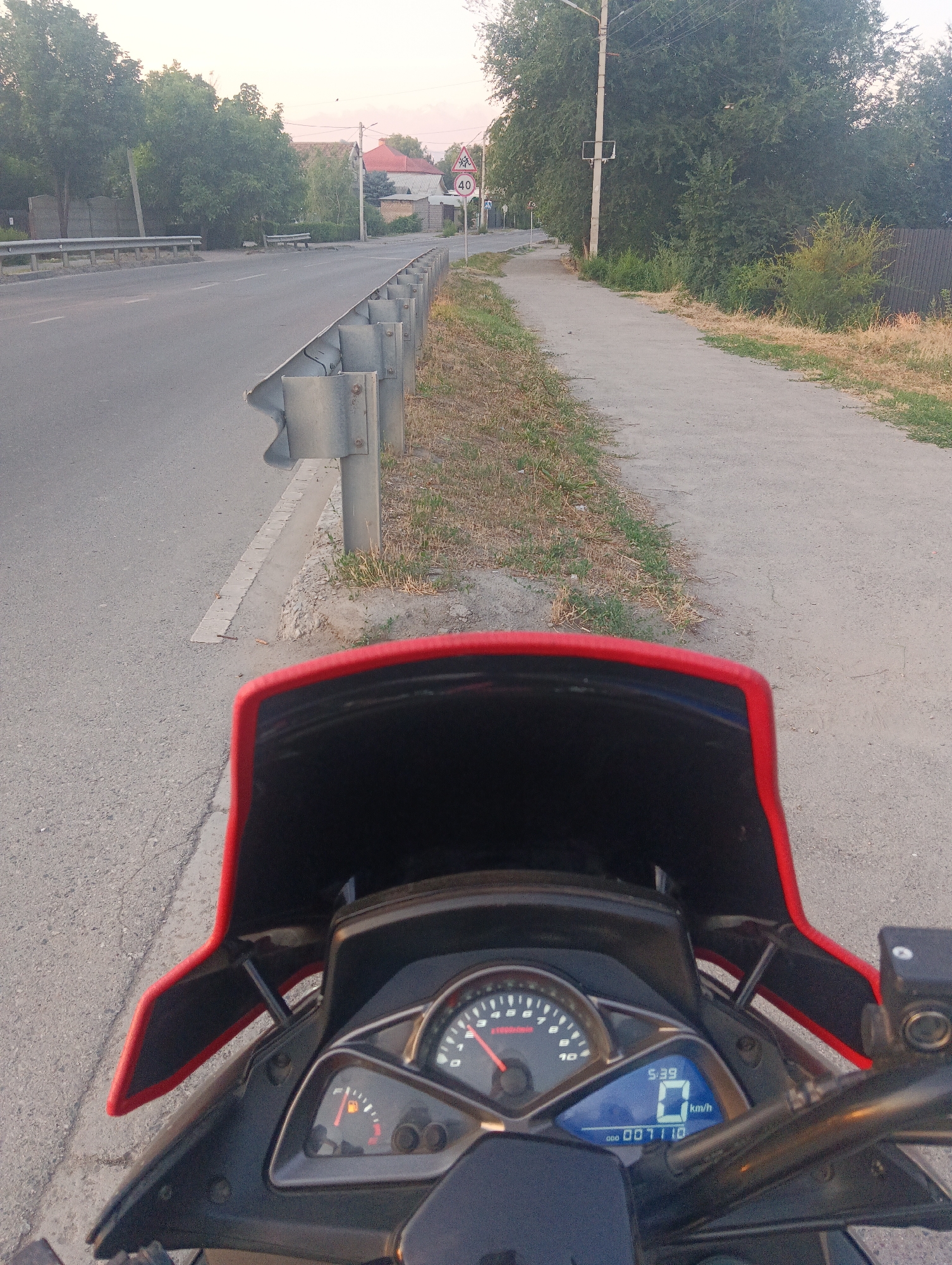 Motorcycle journey through rural roads and a riverside bridge