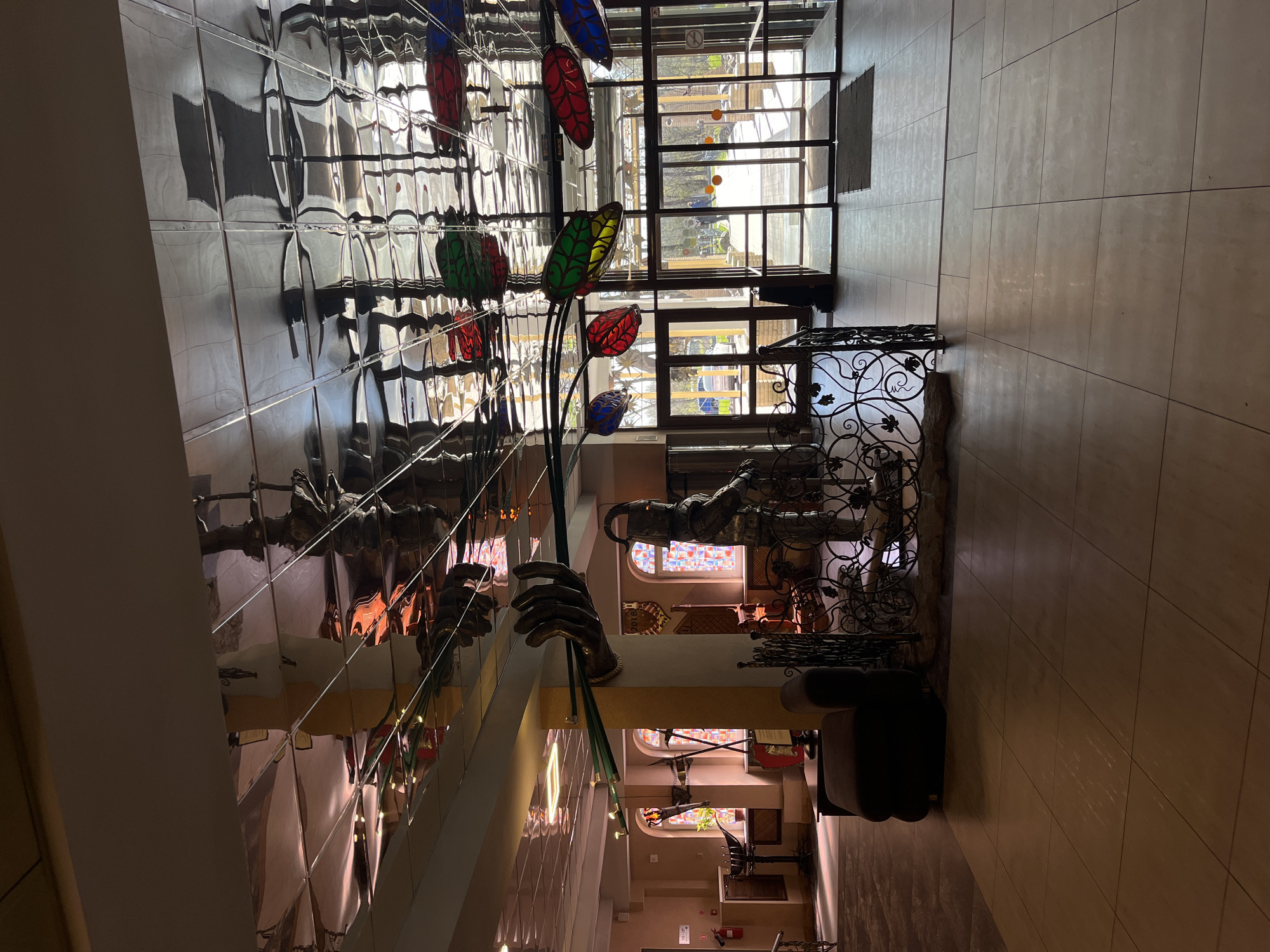 Building interior with reflective tiles documented by witness