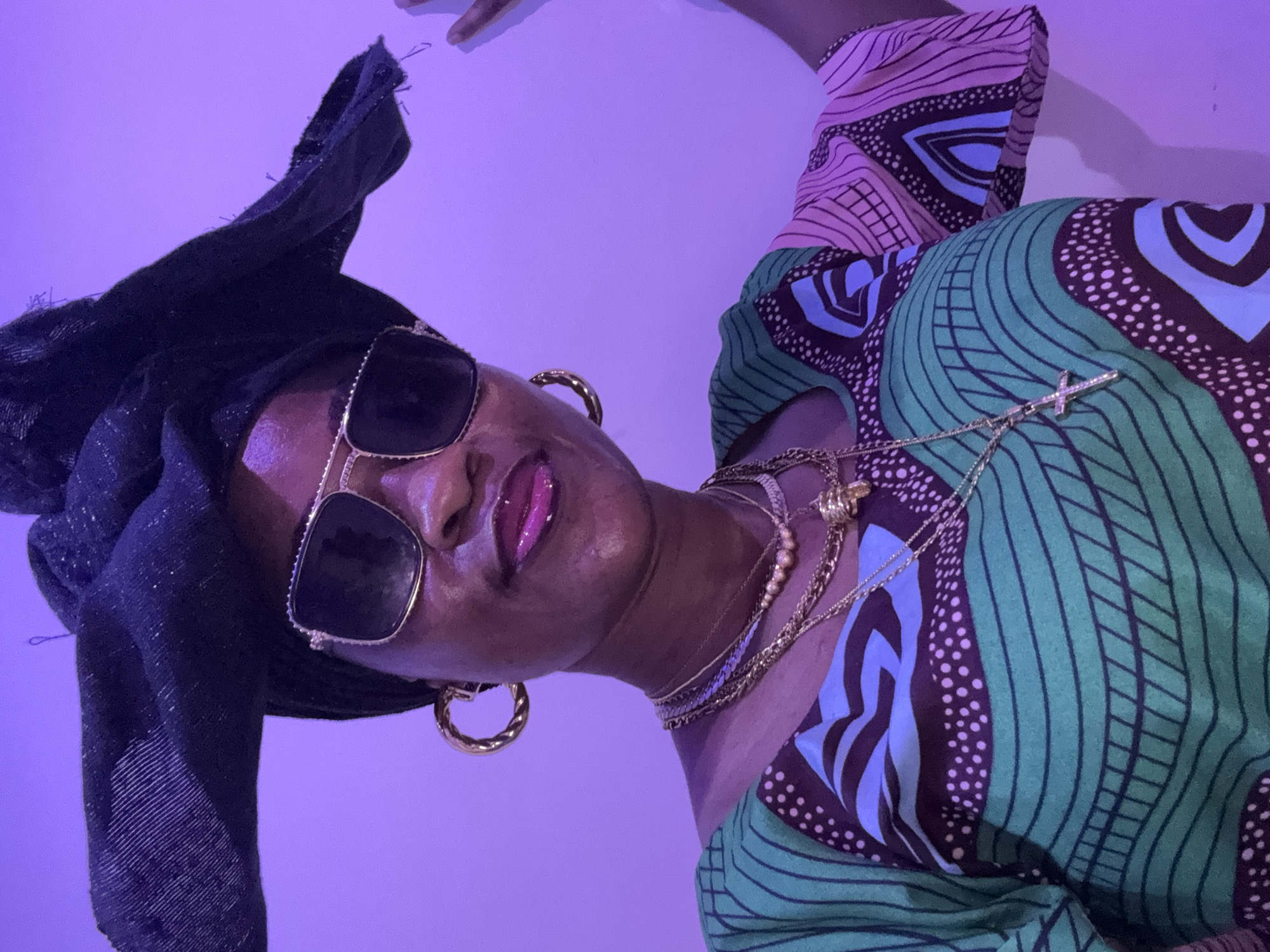 Bold jewelry and patterned style in Ajara, Nigeria