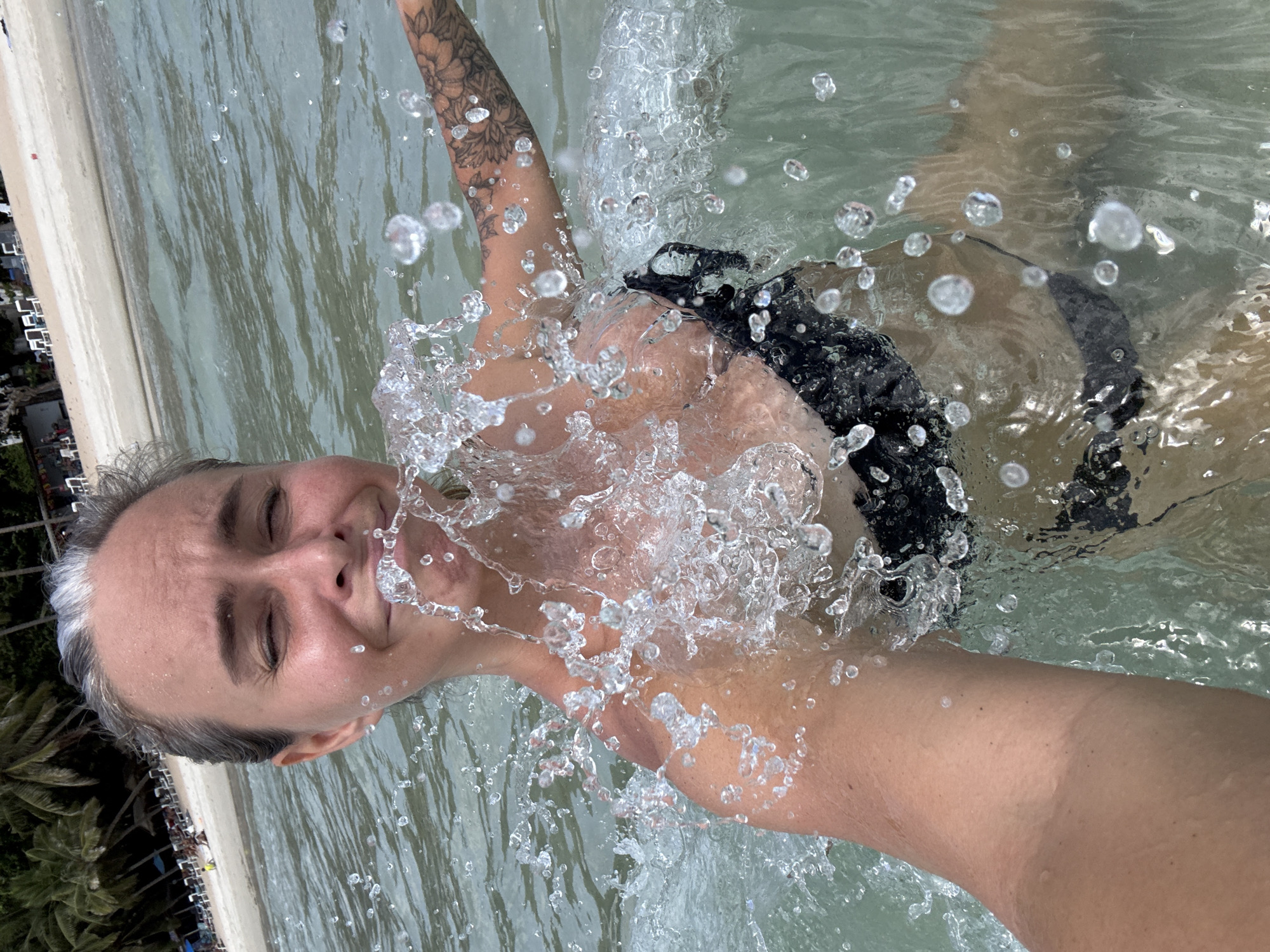 A lively Ko Samui beach morning with swimmers, selfies, and rentals