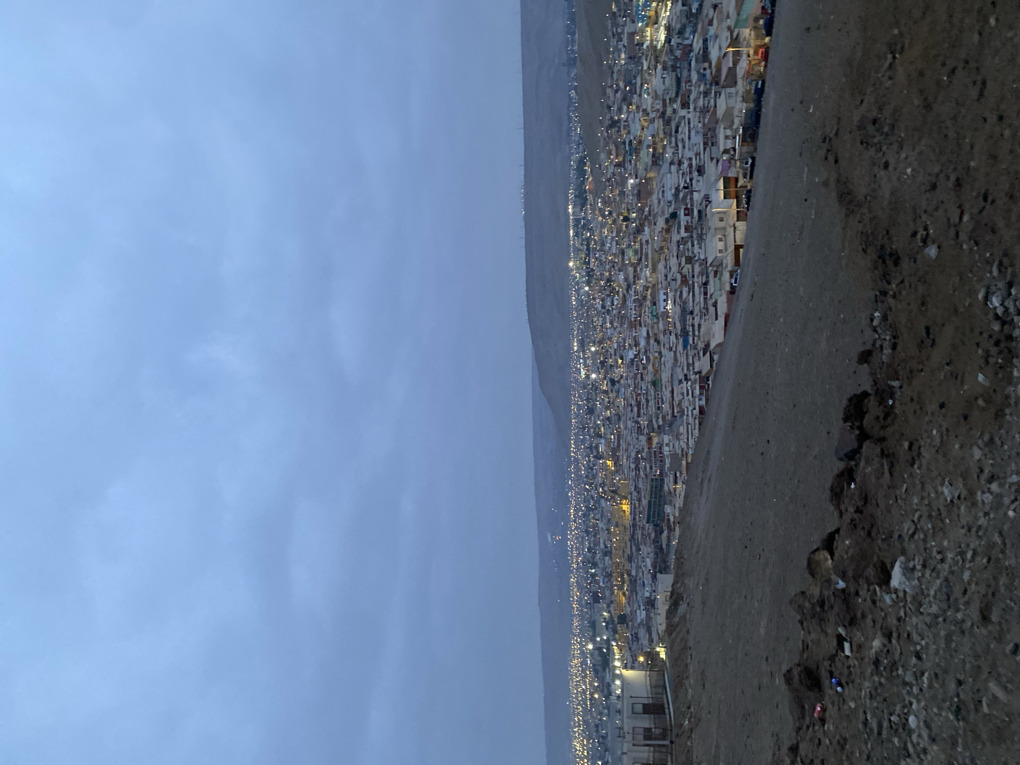 Nighttime view captured of hillside residential area in Arica, Chile