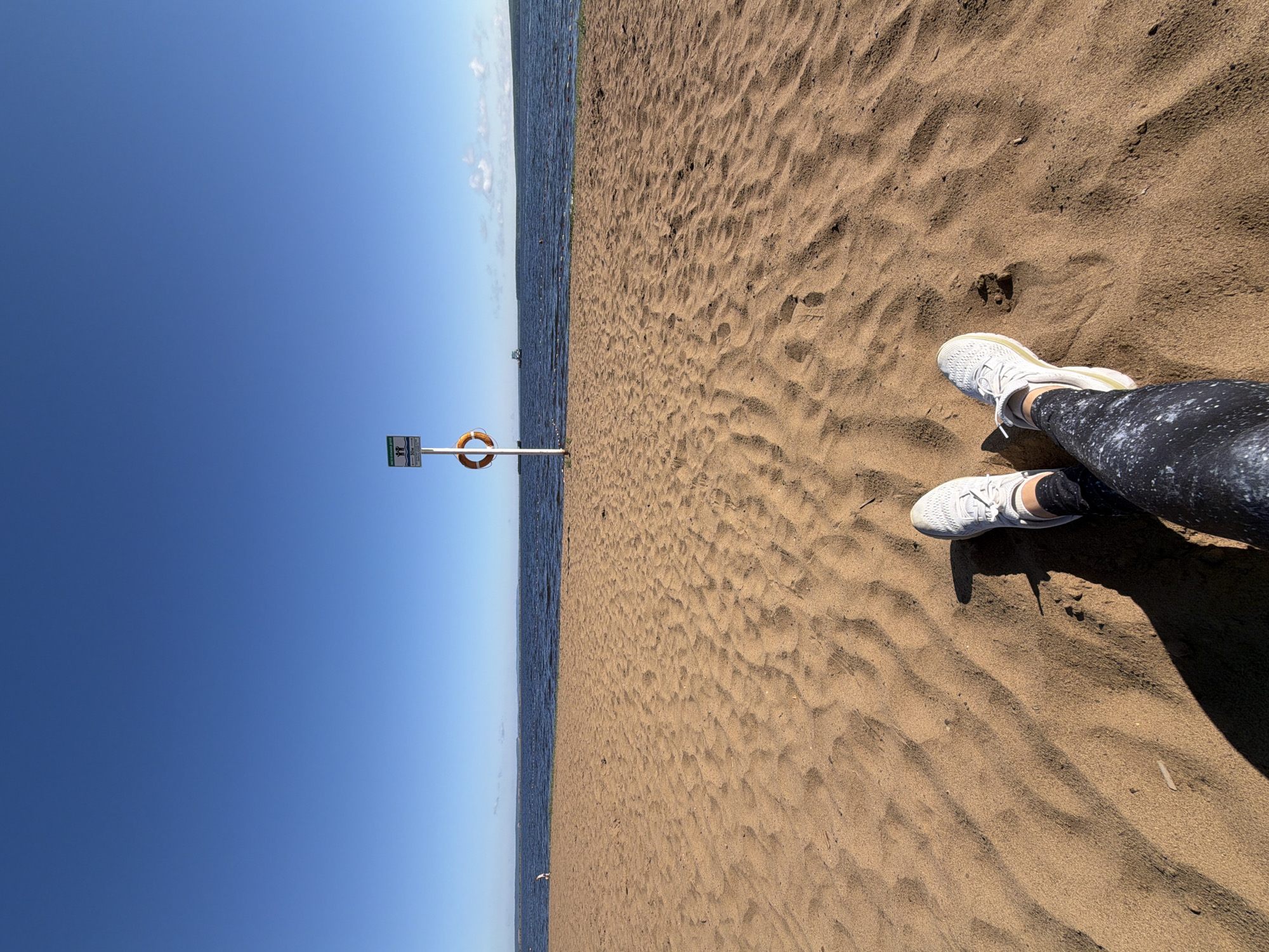 Woman practices early morning yoga on Chaikovsky beach boardwalk