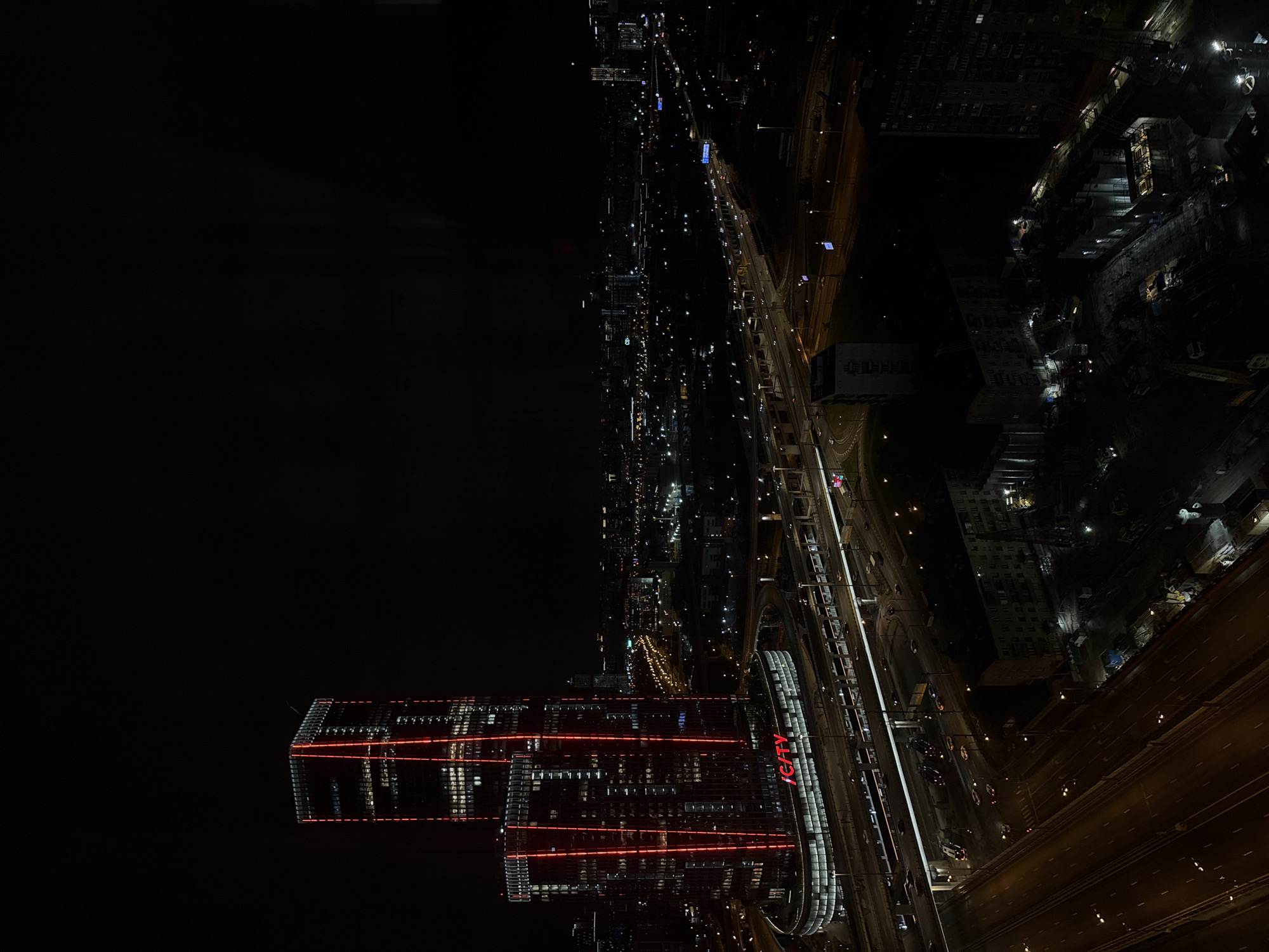 Nighttime aerial footage captures illuminated ICITY complex in Khimki