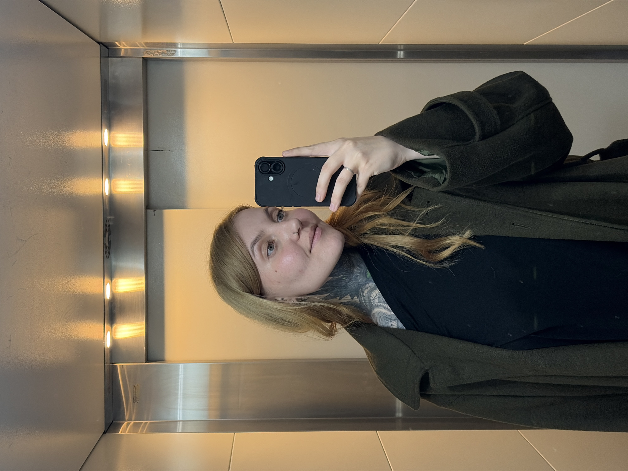 Person takes selfie in elevator in Izhevsk