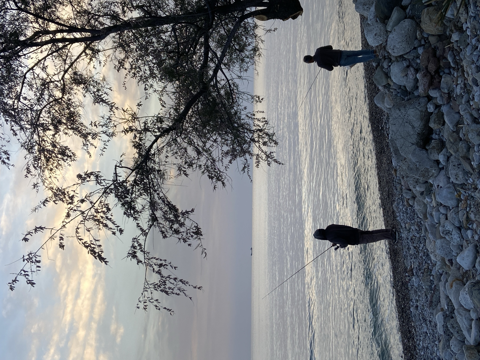 Two people fish along Bar Montenegro coast