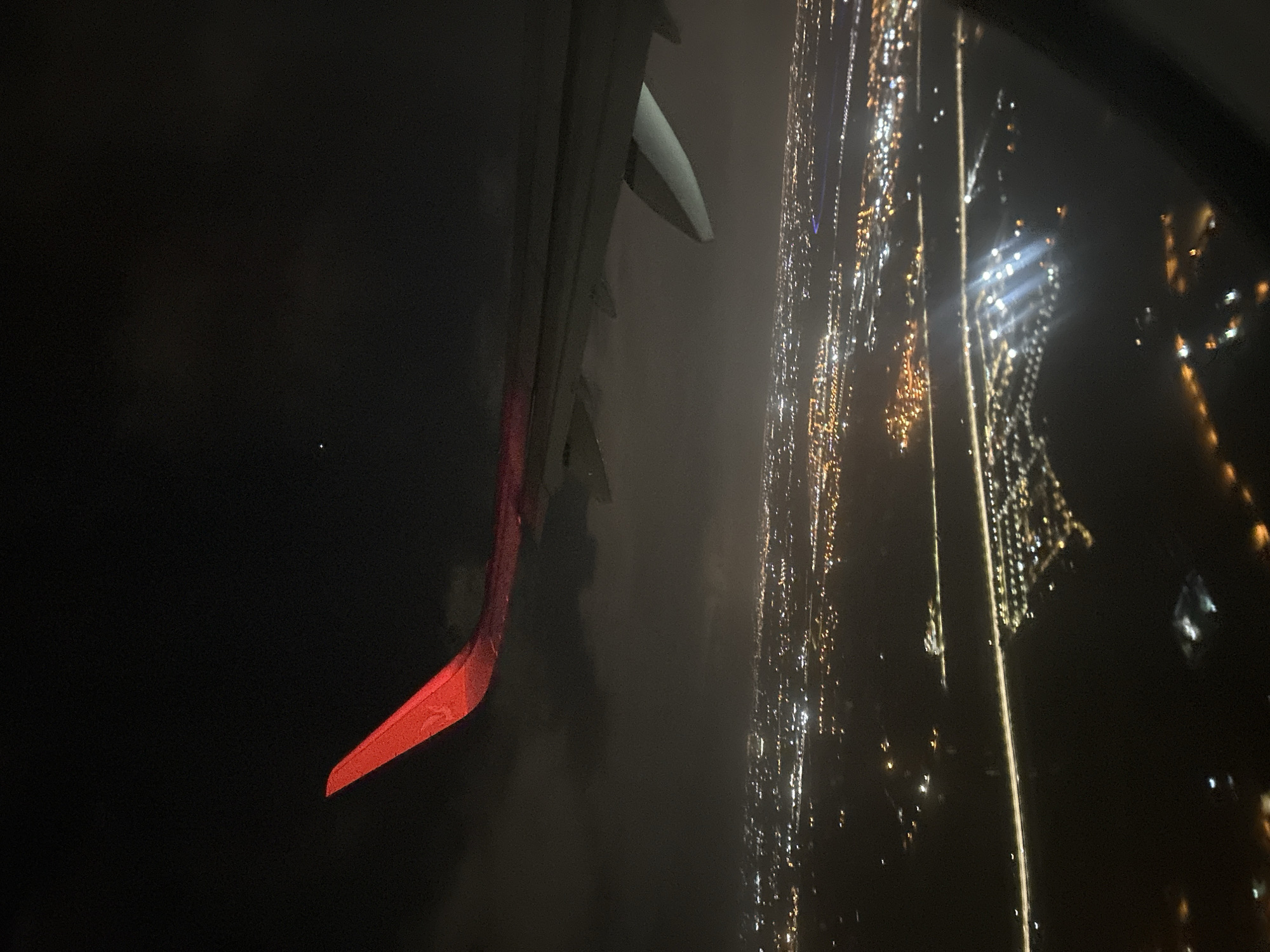 Nighttime aerial view captures city lights over Victoria, Morocco
