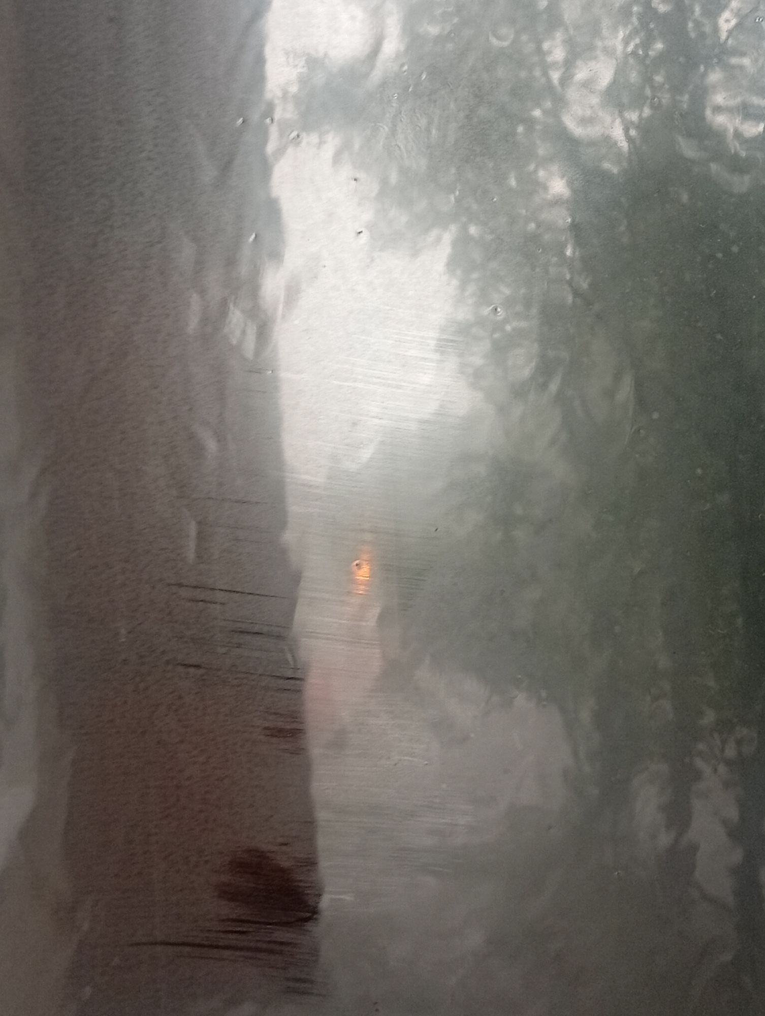 Heavy rain rolls through Minusinsk on a gray July morning