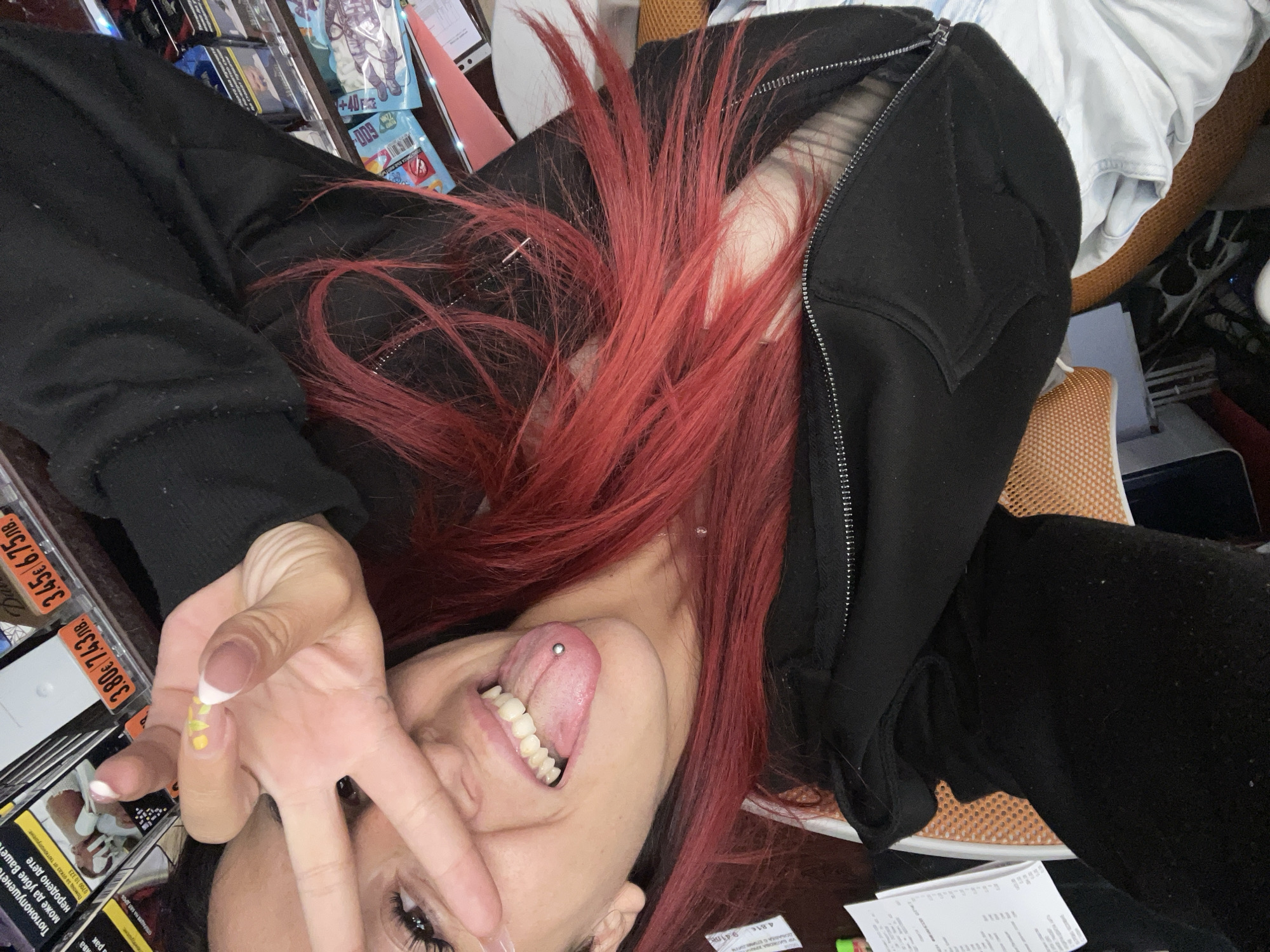 Red-haired woman makes peace sign in Sofia morning photo
