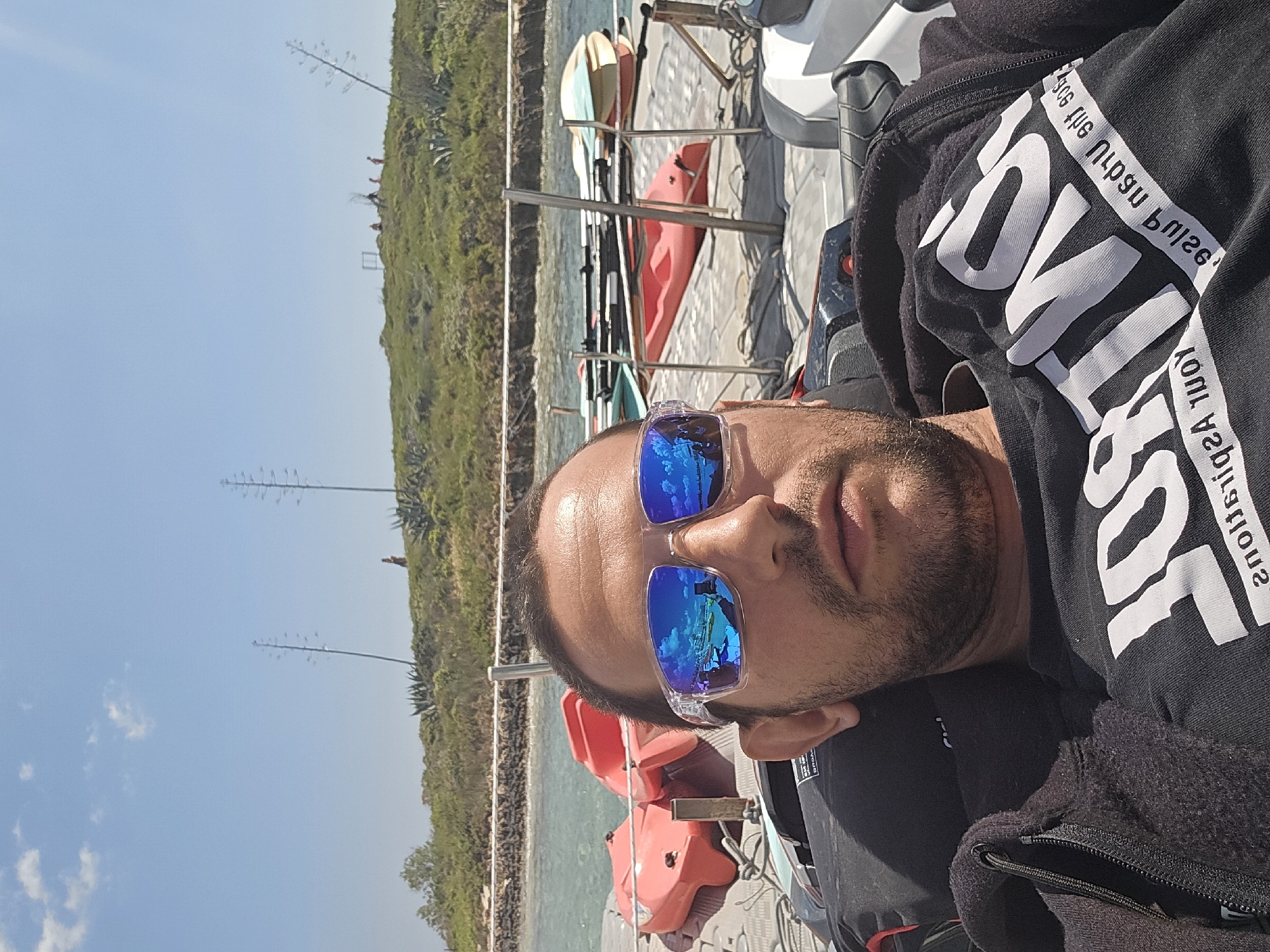 Man relaxes on dock in Ayia Napa marina