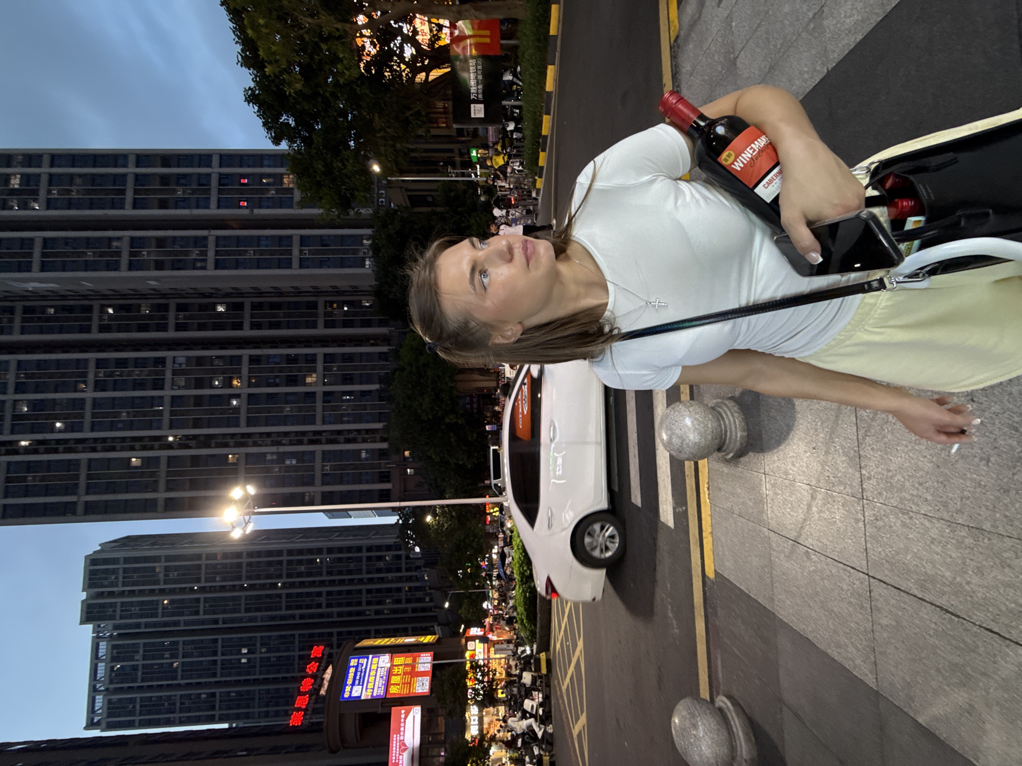 Haizhu District streets come alive at dusk near a metro stop