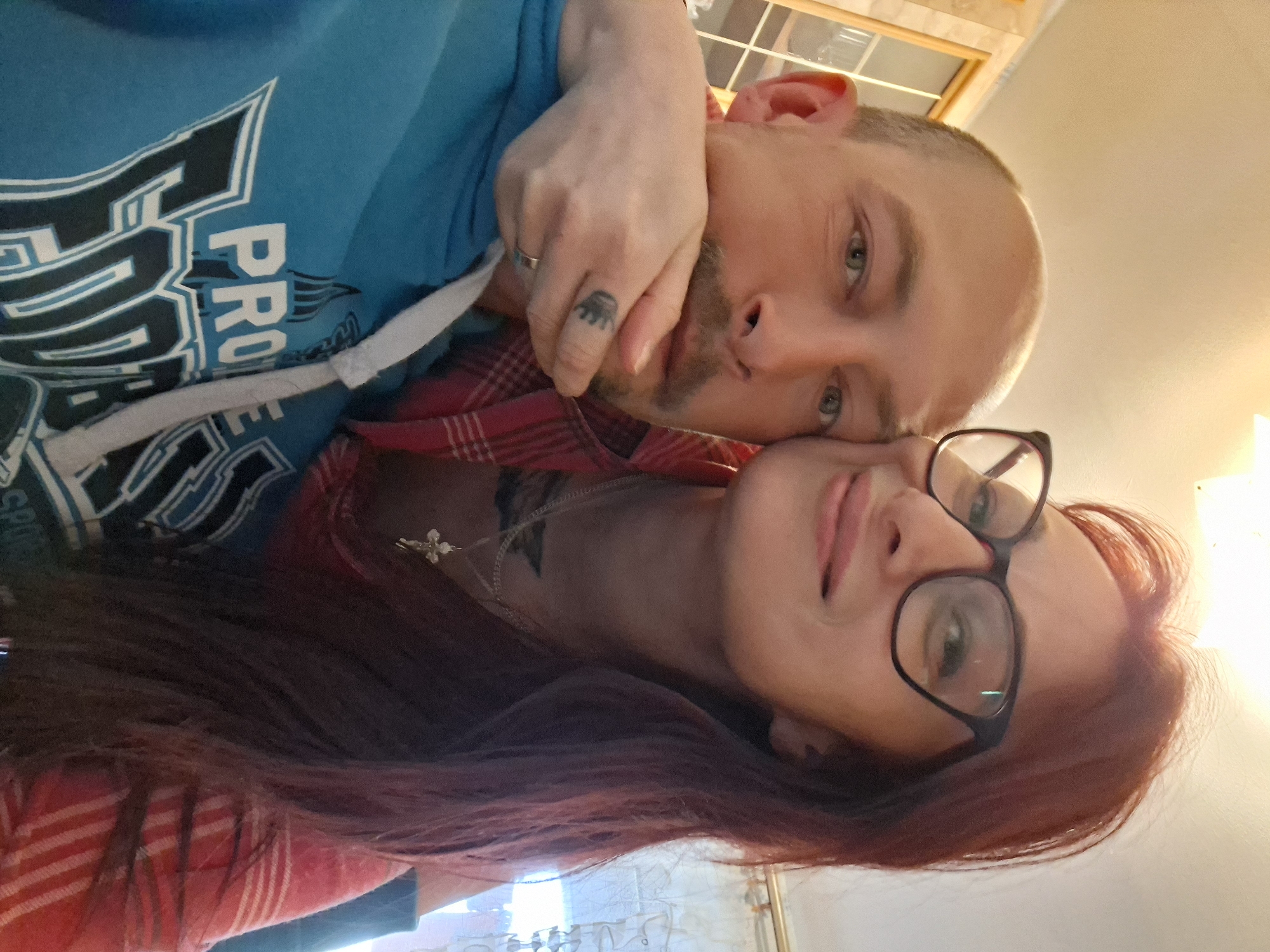 Couple takes indoor selfie at unknown location