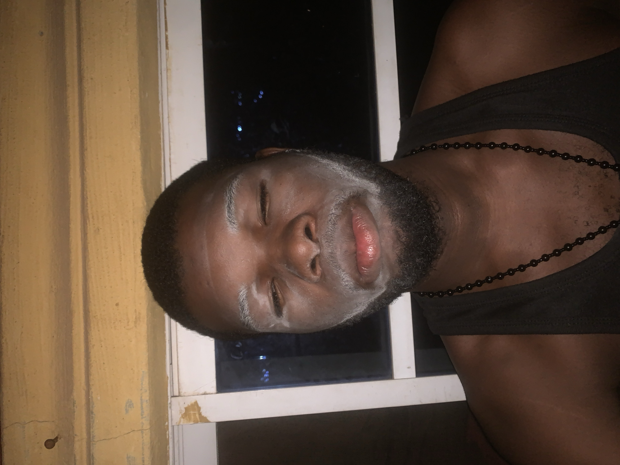 Nigerian resident documents evening skincare routine with white face mask