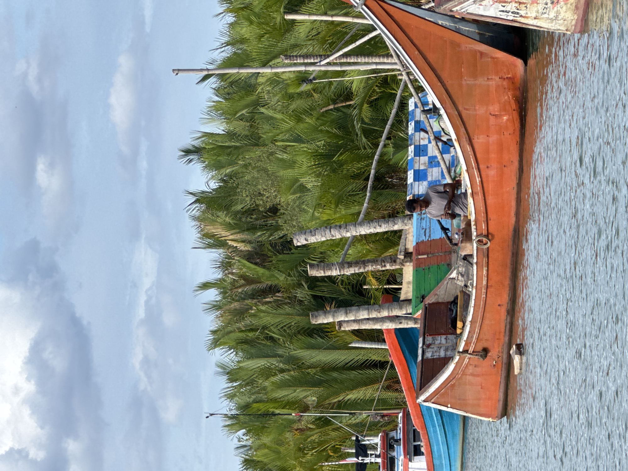 Fishing boats and riverside life in Reudeuep, Indonesia