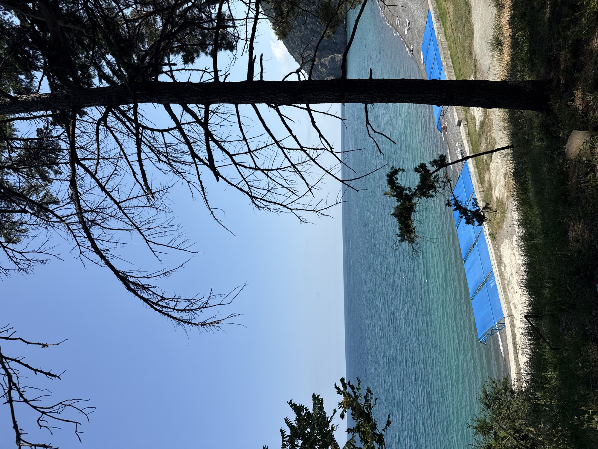 Sunny afternoon walk along Partenit's coastal promenade