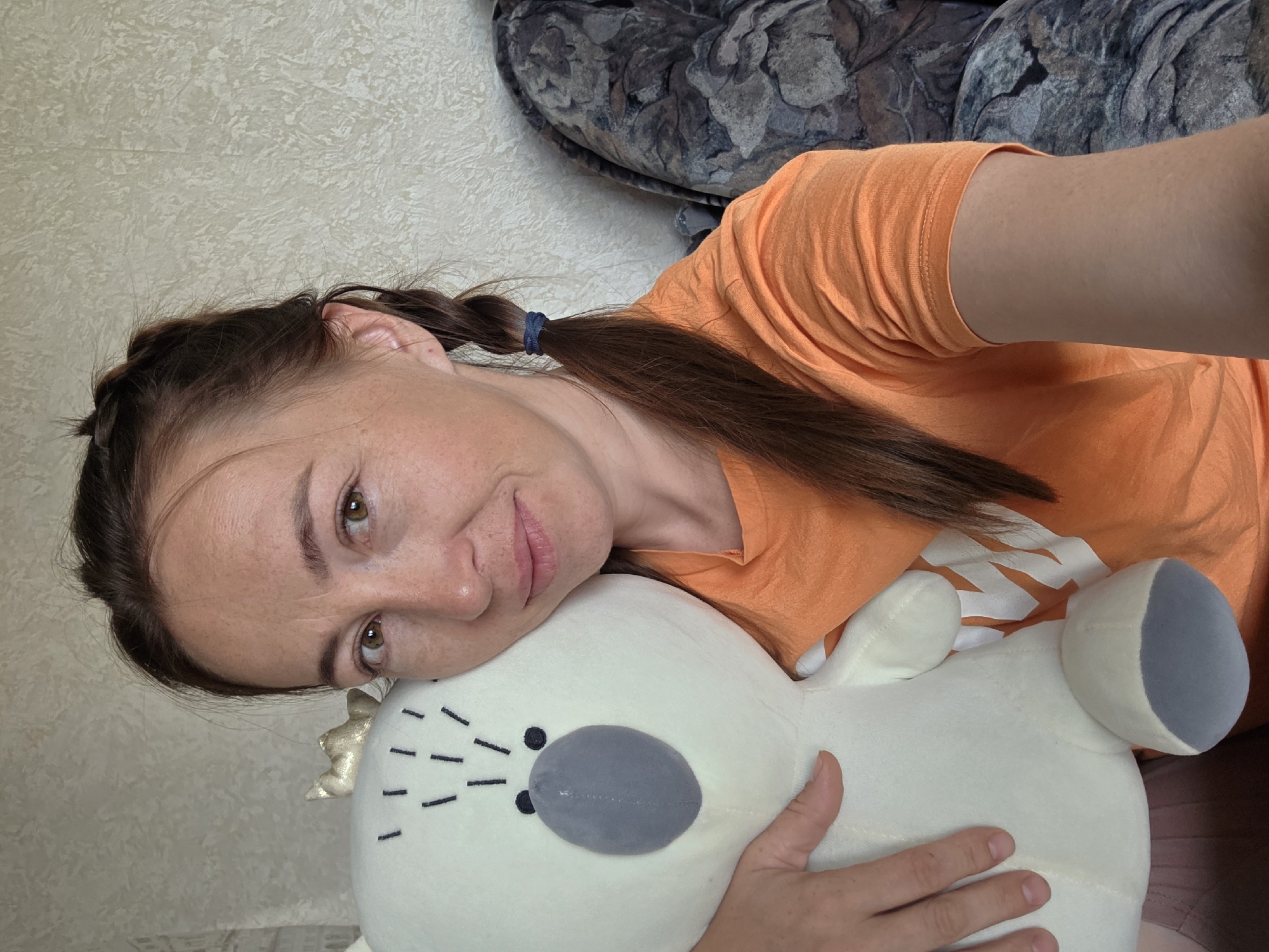Casual snapshots featuring a white stuffed animal and a selfie