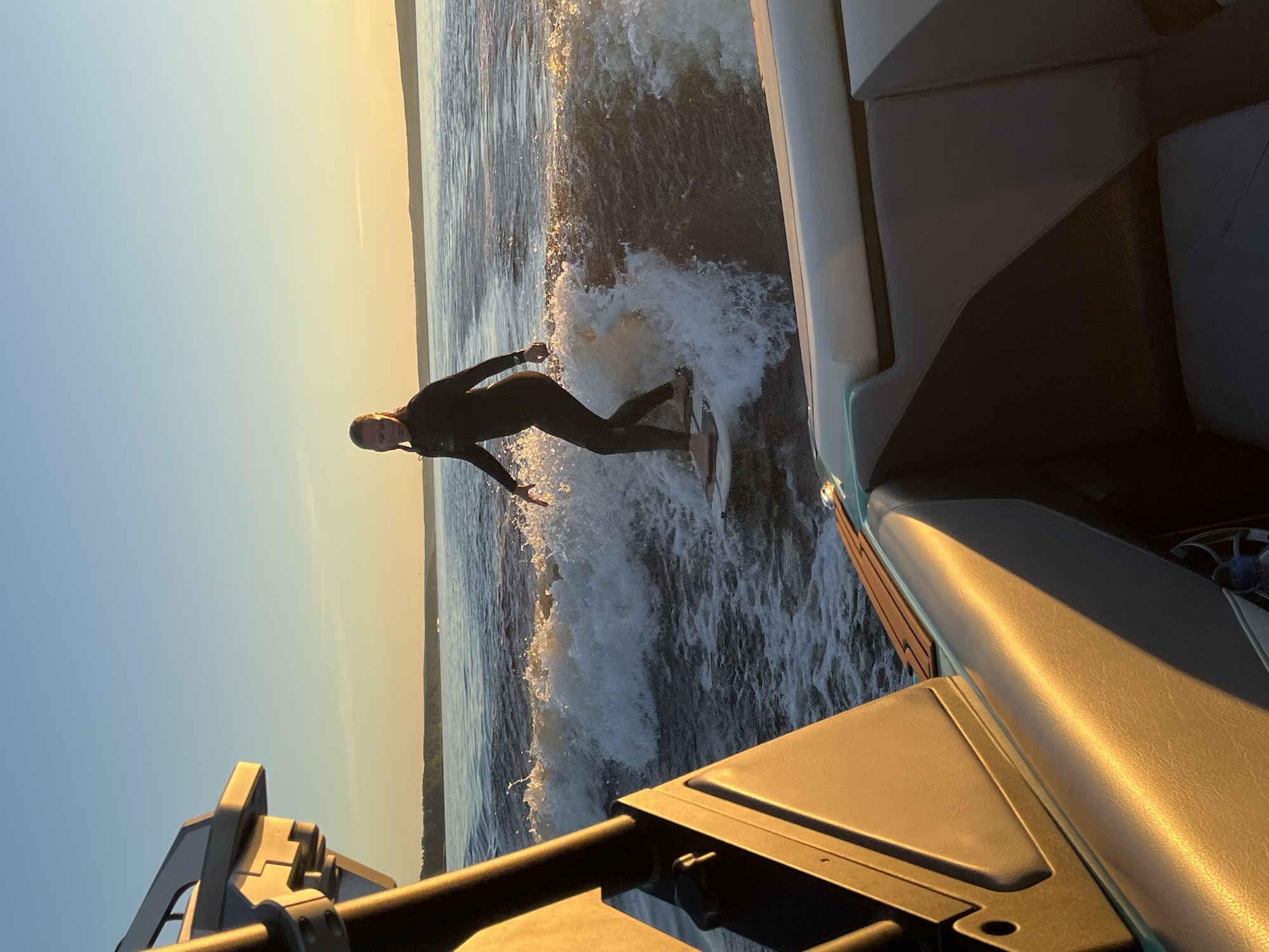 Wake surfing at sunset on Lake Gromovskoye, Russia