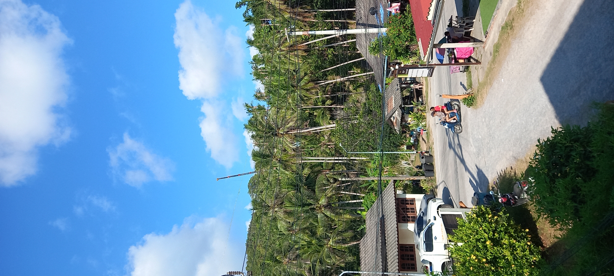 Sunny street scene captured in Baan Chaloklum, Thailand