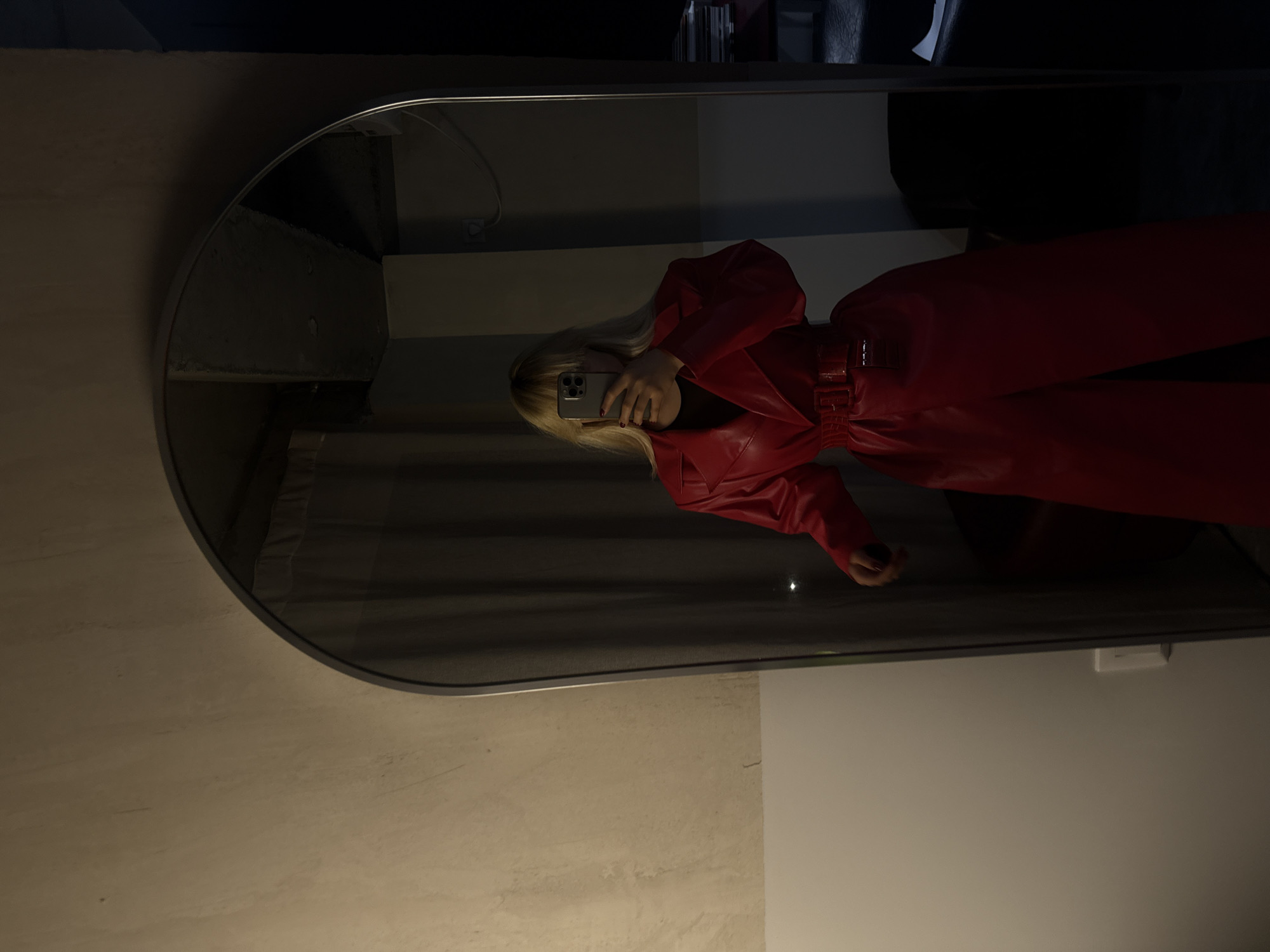 Mirror selfie captured in red jumpsuit in Yerevan