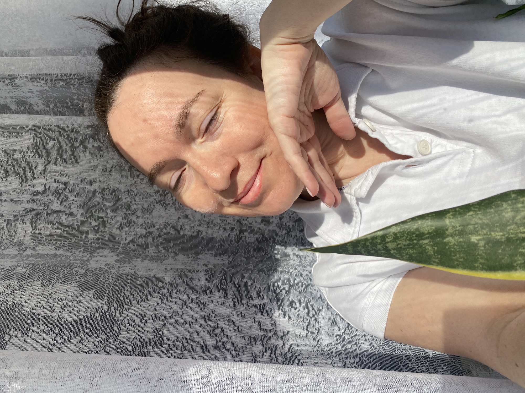 Woman resting on patterned surface observed in Ольховка, Russia