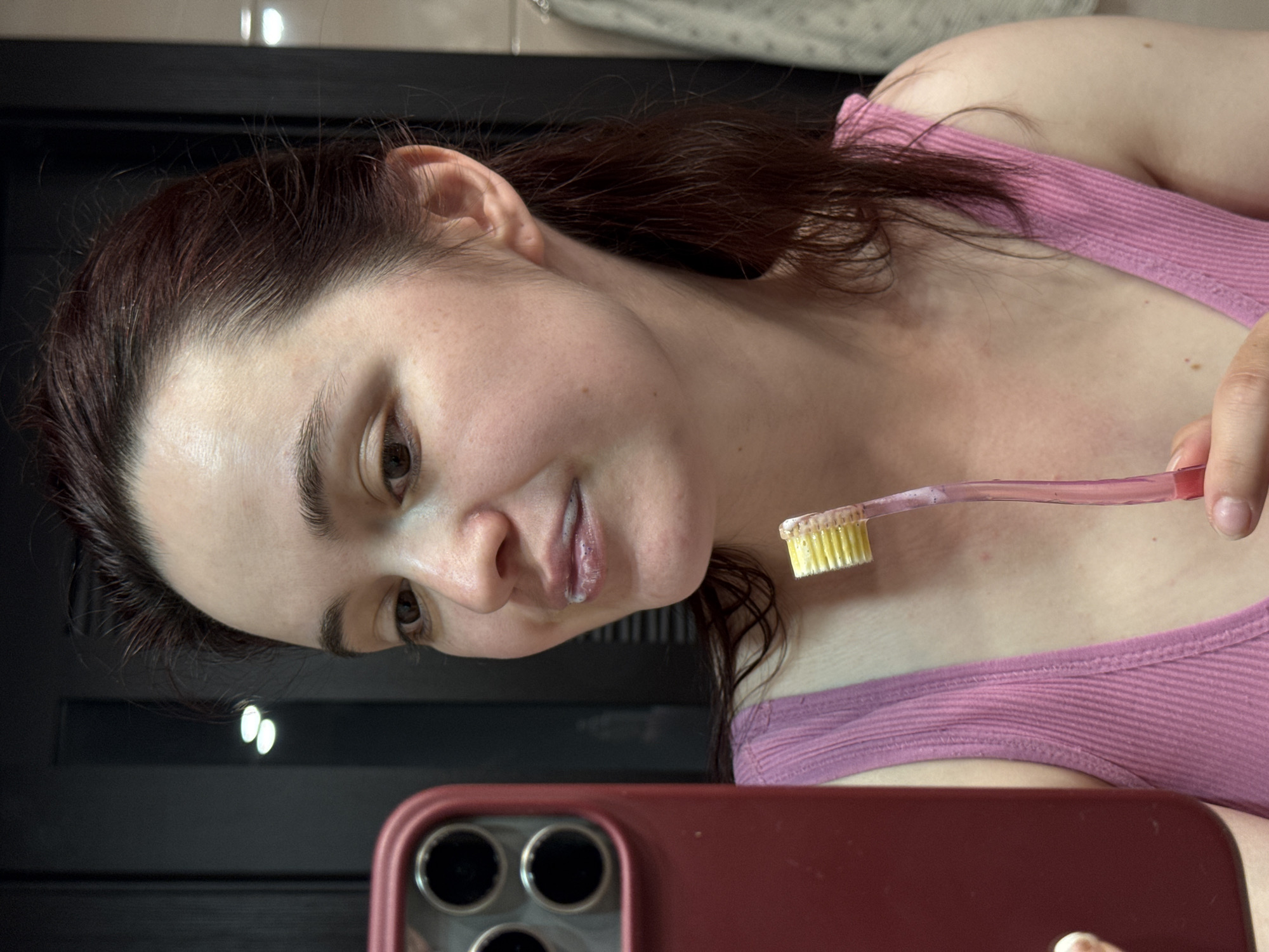 Woman documents late-night dental routine in Sochi bathroom selfies