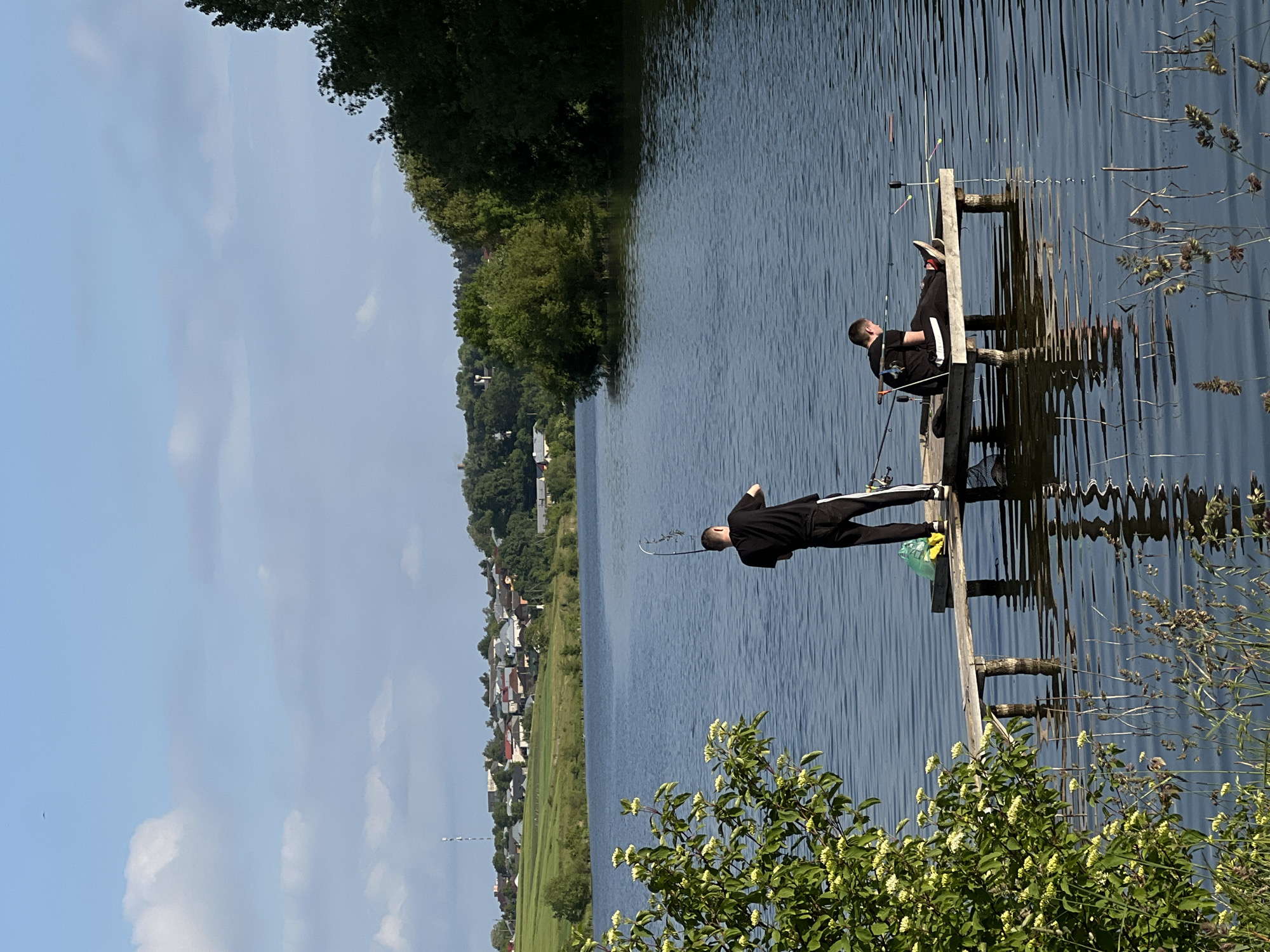 Two fishermen enjoy peaceful afternoon at Bazaryntsi lake