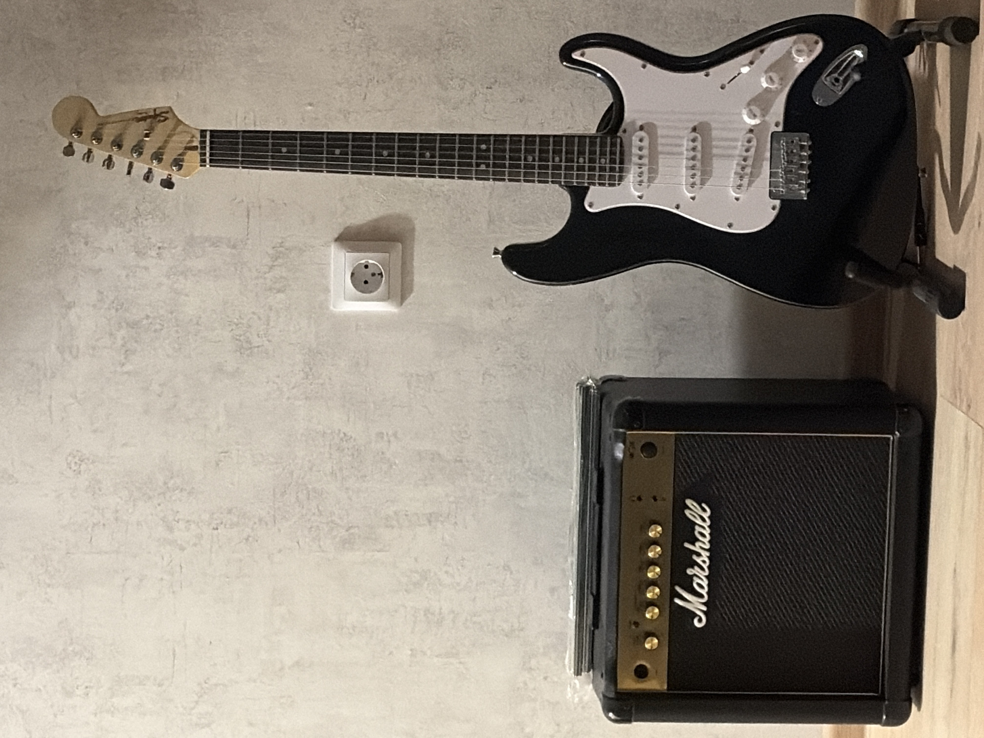 Guitar, lighters, and a Marshall amp in a Yekaterinburg living room