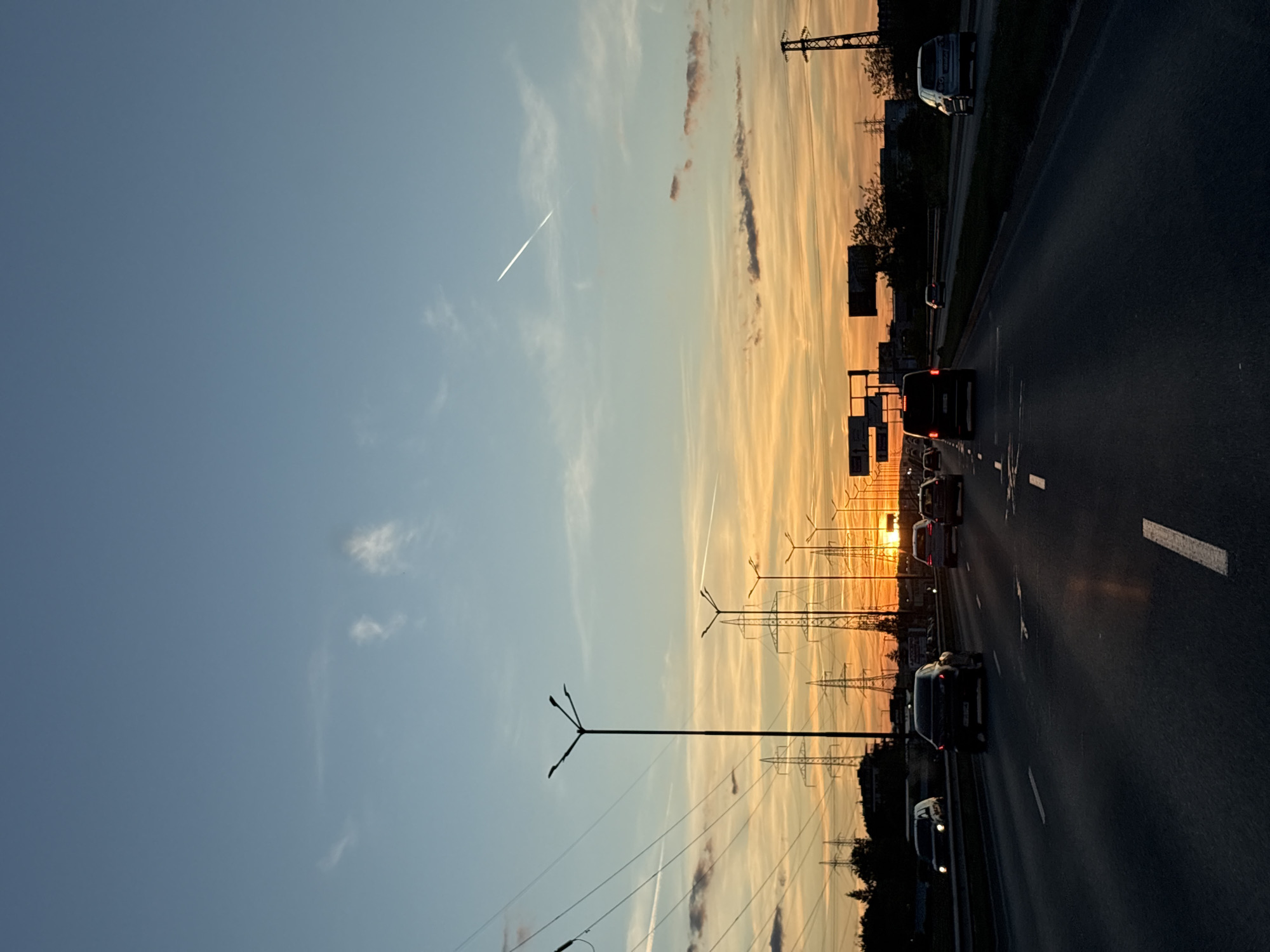 Evening traffic flows through Sofia highway at sunset