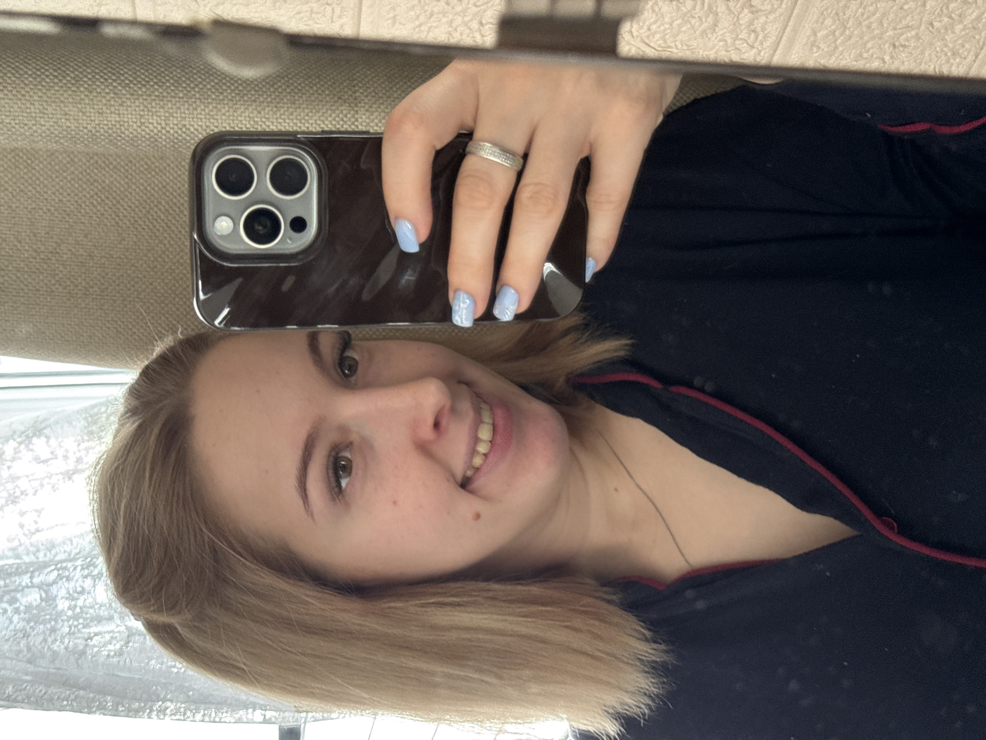 Woman takes mirror selfies with toddler in Donetsk home